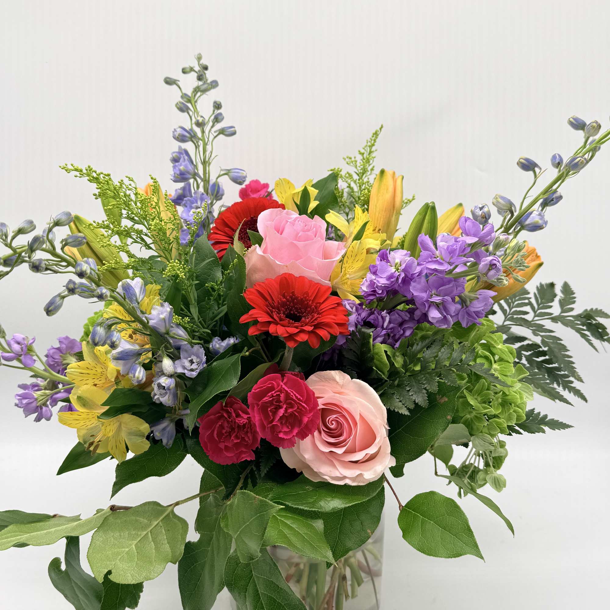 Celebrating life with colorful blooms that inspire and delight, this flower bouquet