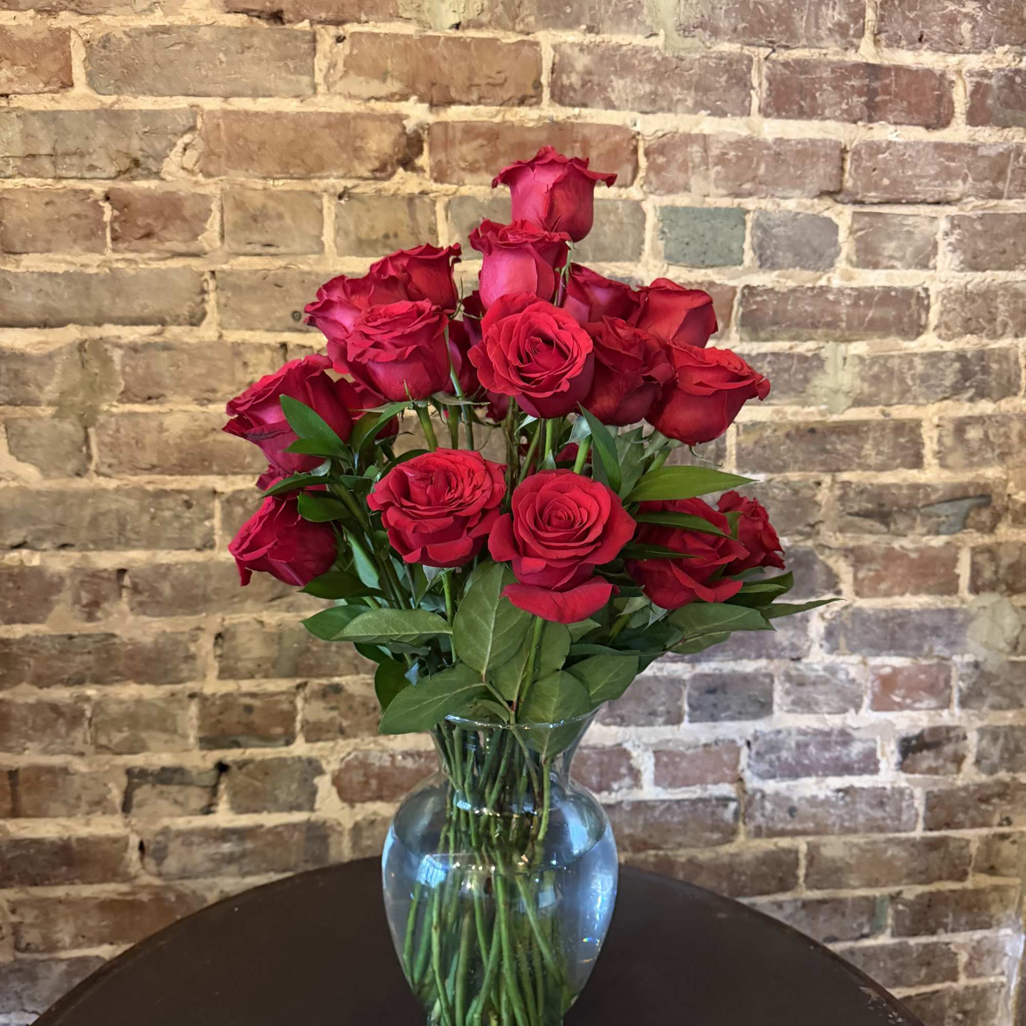 Bouquet of red roses in a clear glass vase