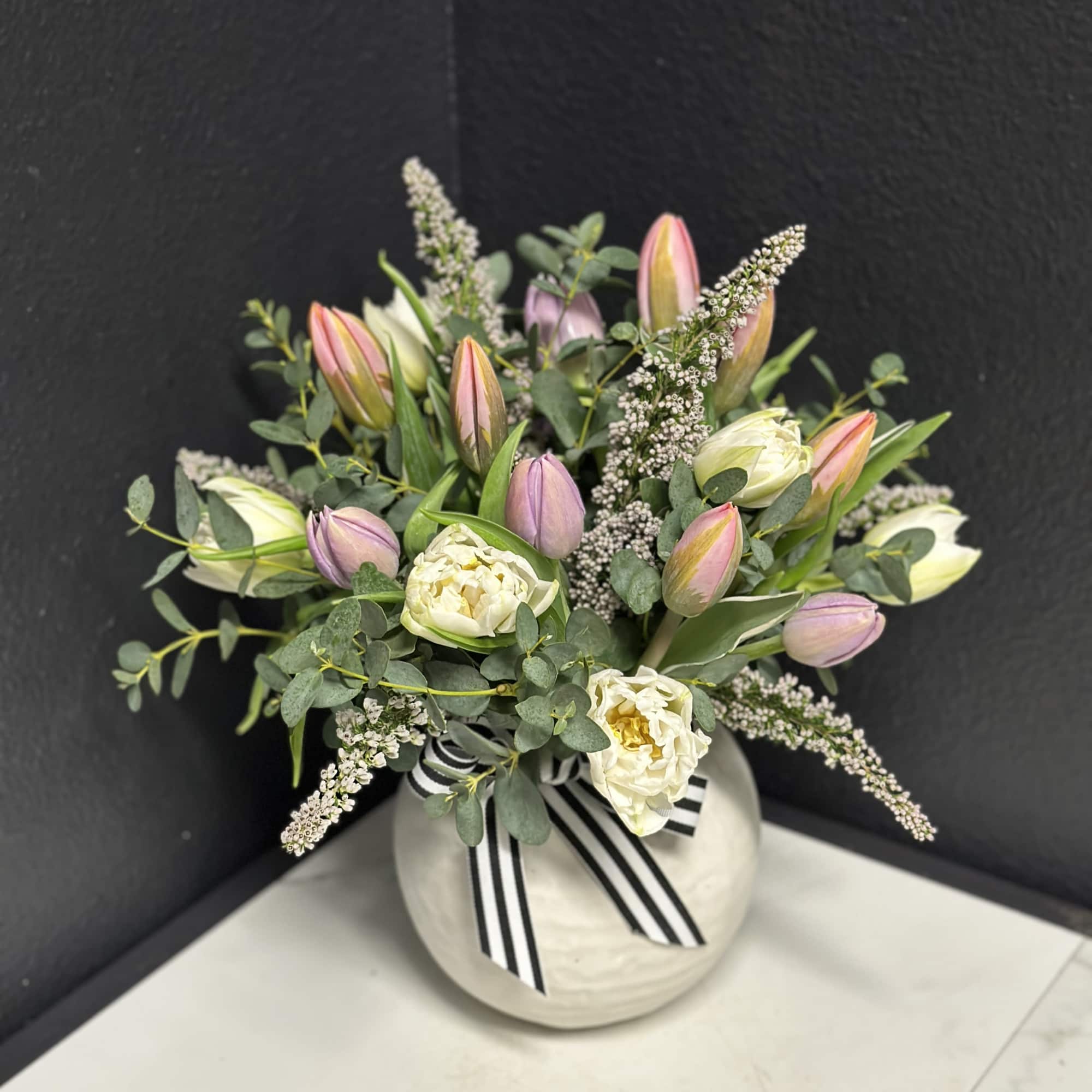 Twenty of our premium Tulips in pastel shades are arranged with seasonal