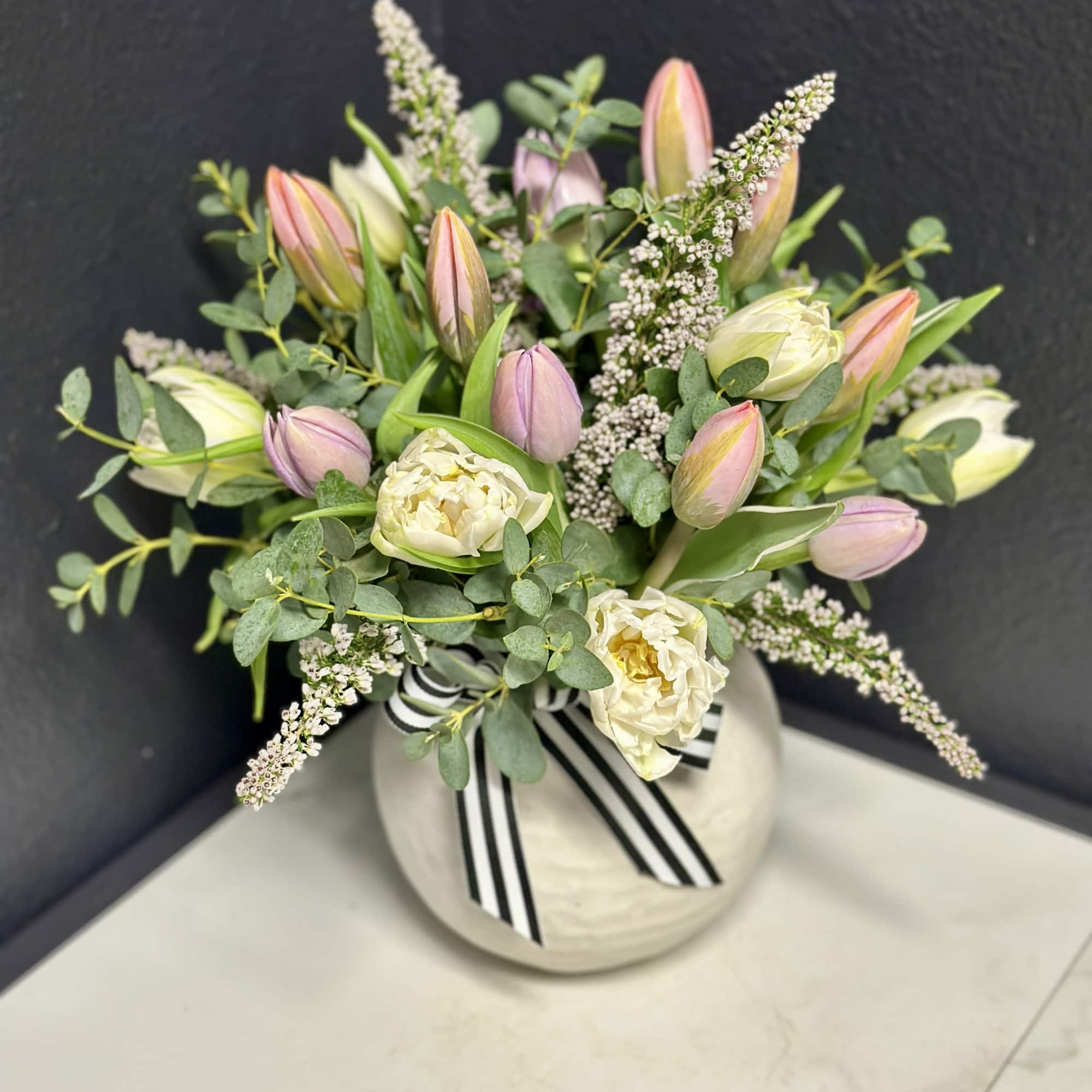 Twenty of our premium Tulips in pastel shades are arranged with seasonal