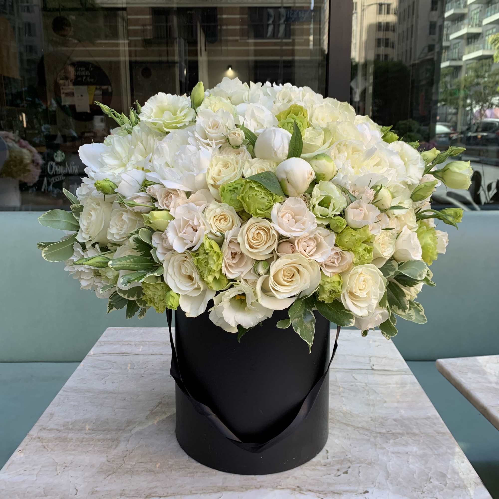 Elevate your gifting with a timeless and sophisticated arrangement, meticulously presented in