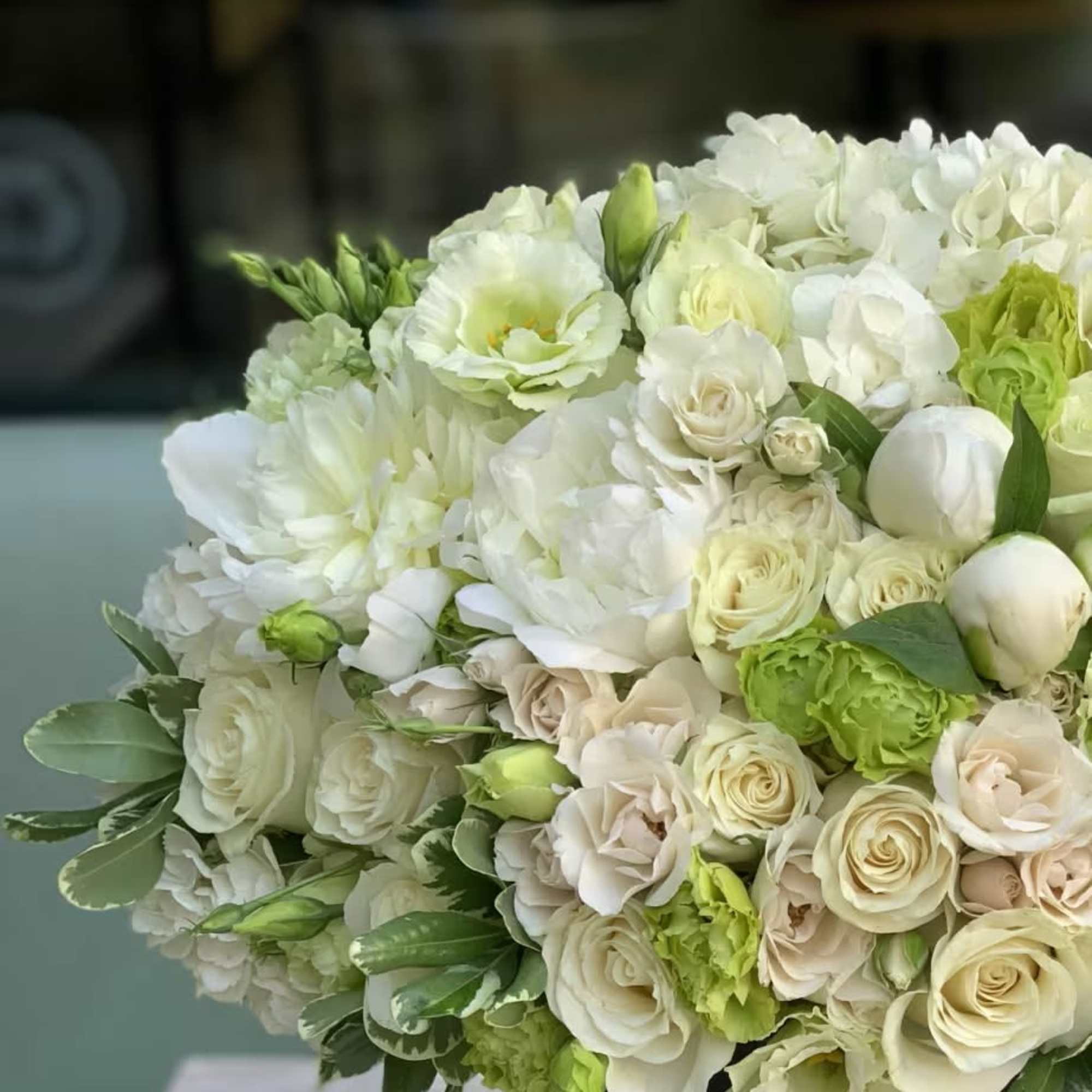 Elevate your gifting with a timeless and sophisticated arrangement, meticulously presented in