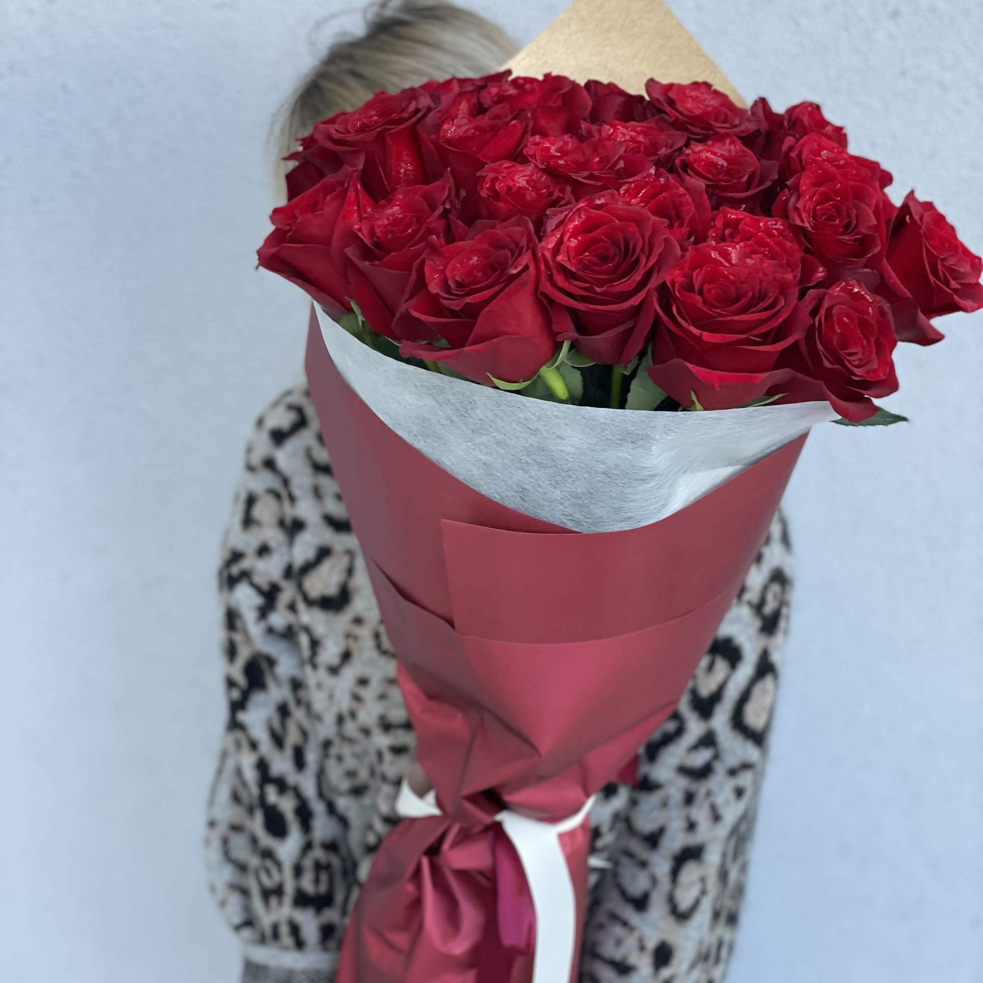 A breathtaking bouquet of 25 premium long stem red roses, thoughtfully designed