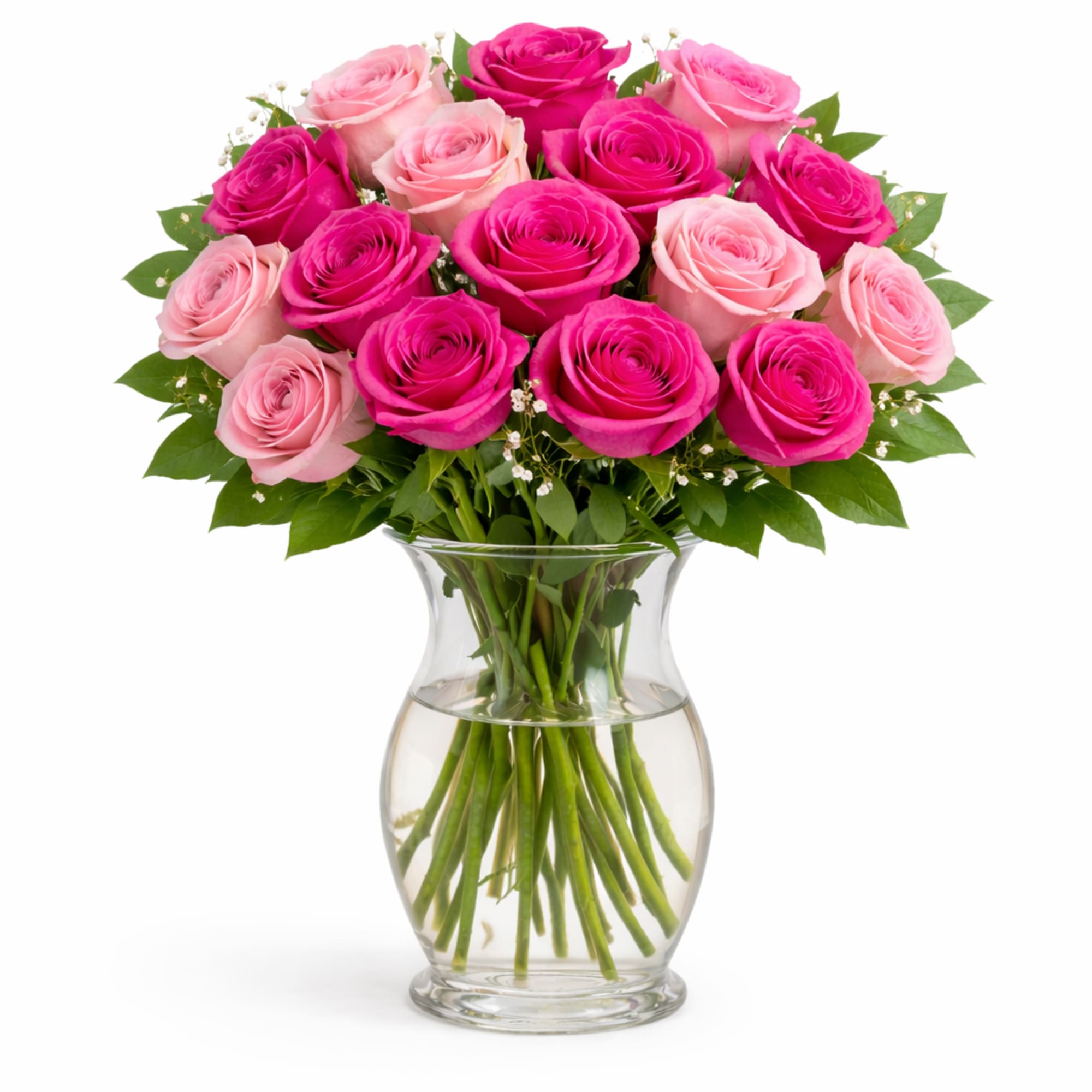 Pink and hot pink roses arranged in a clear glass vase