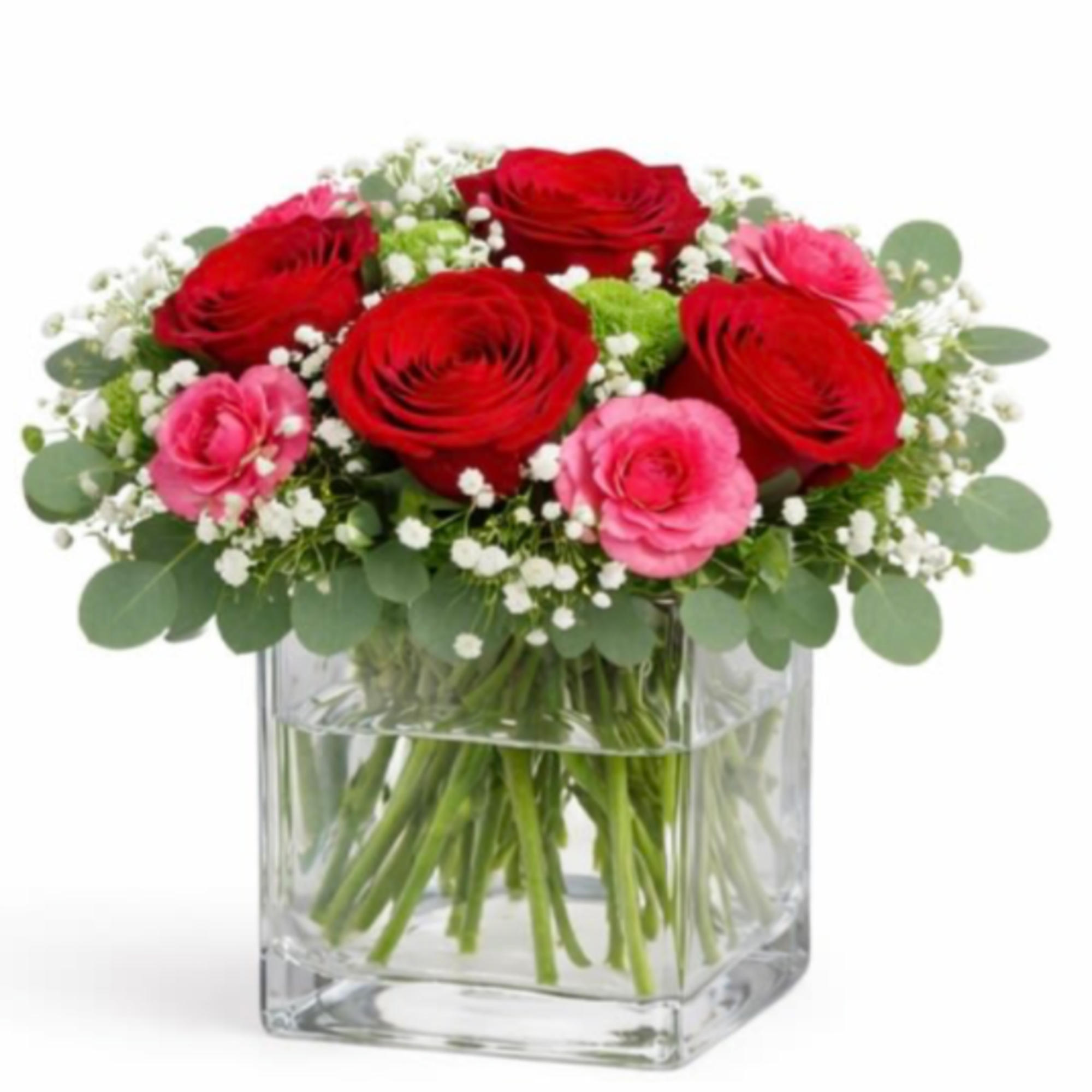 Red and pink roses in a clear glass vase with baby's breath