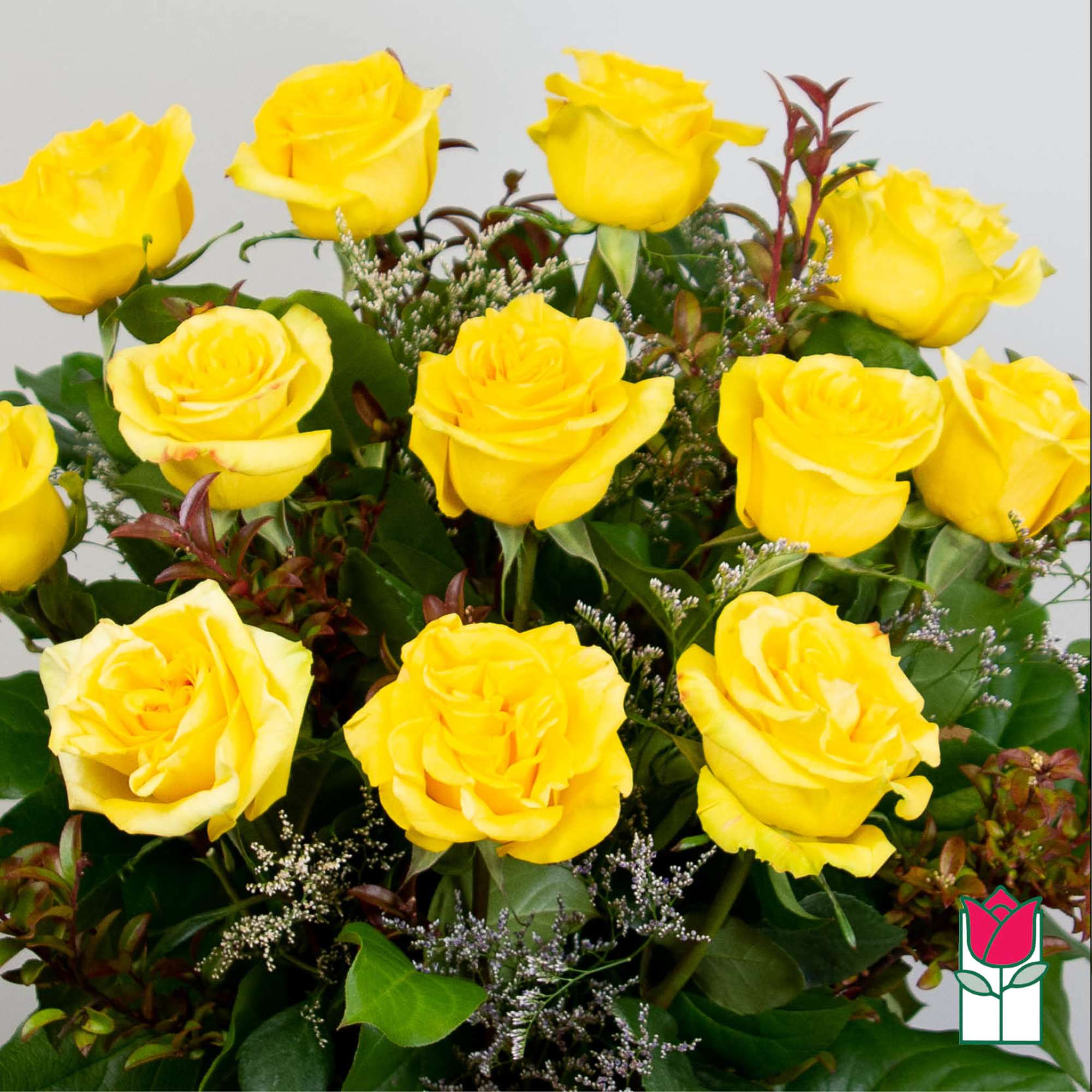 Bouquet of yellow roses with greenery