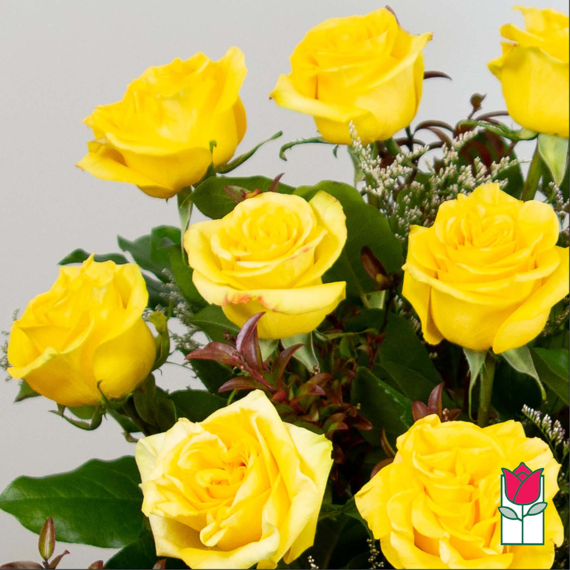 Bouquet of yellow roses with greenery