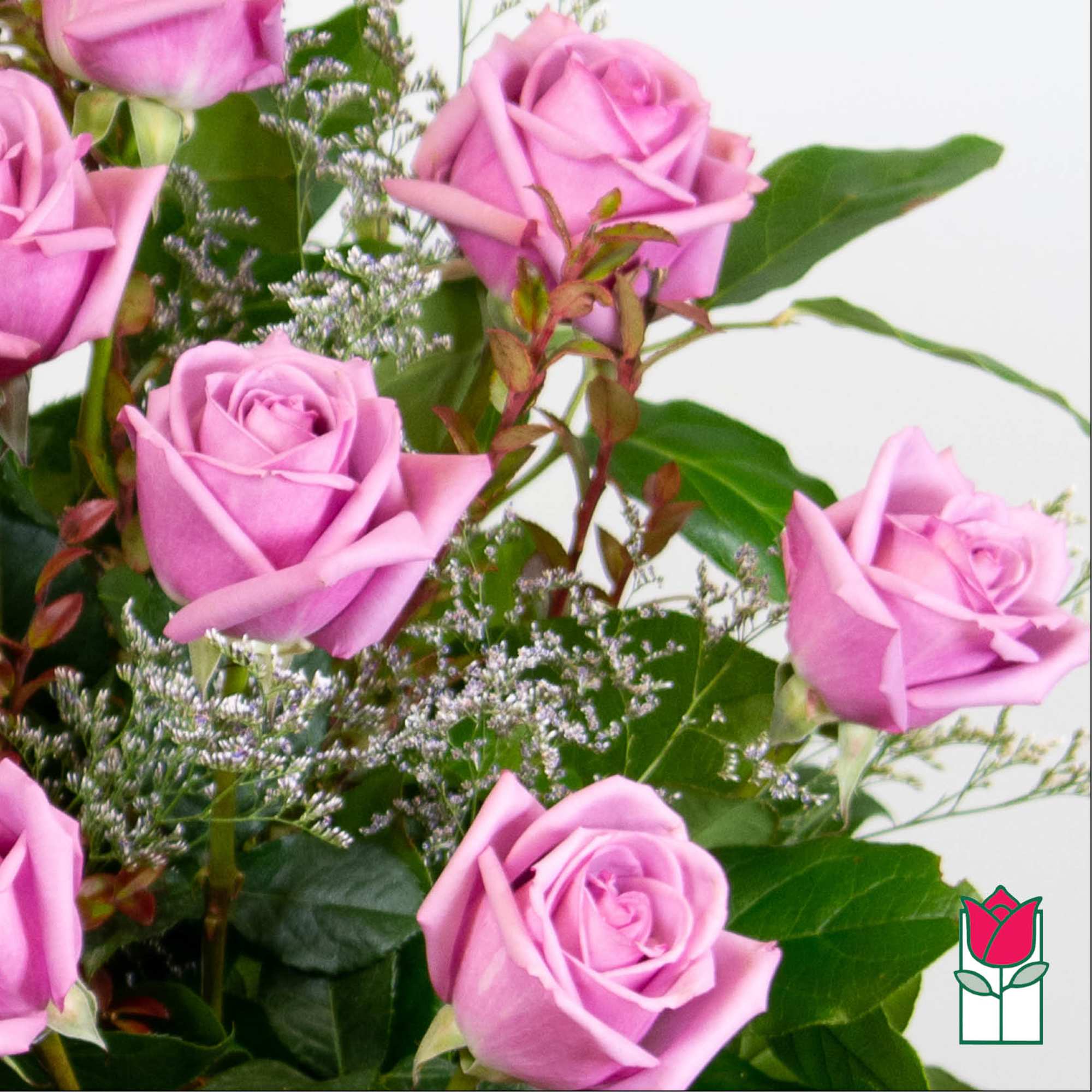 Bouquet of pink roses with greenery and filler flowers