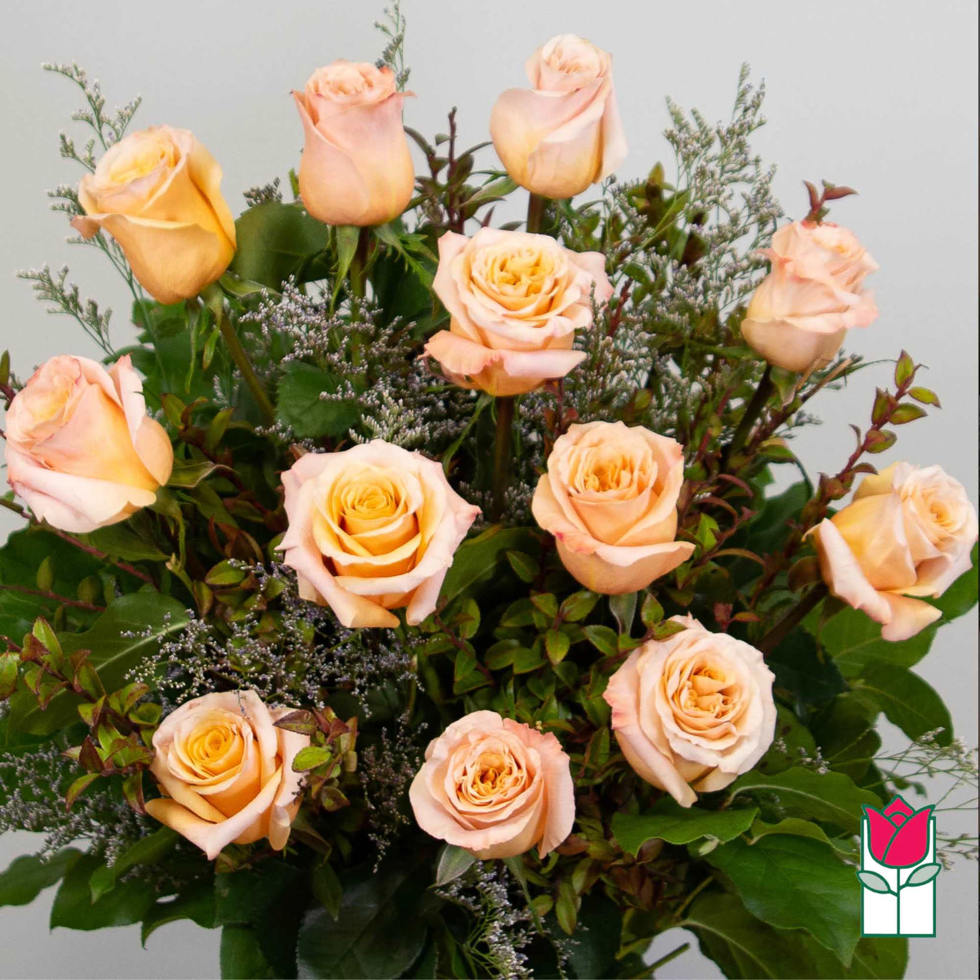 Bouquet of peach roses with mixed greenery