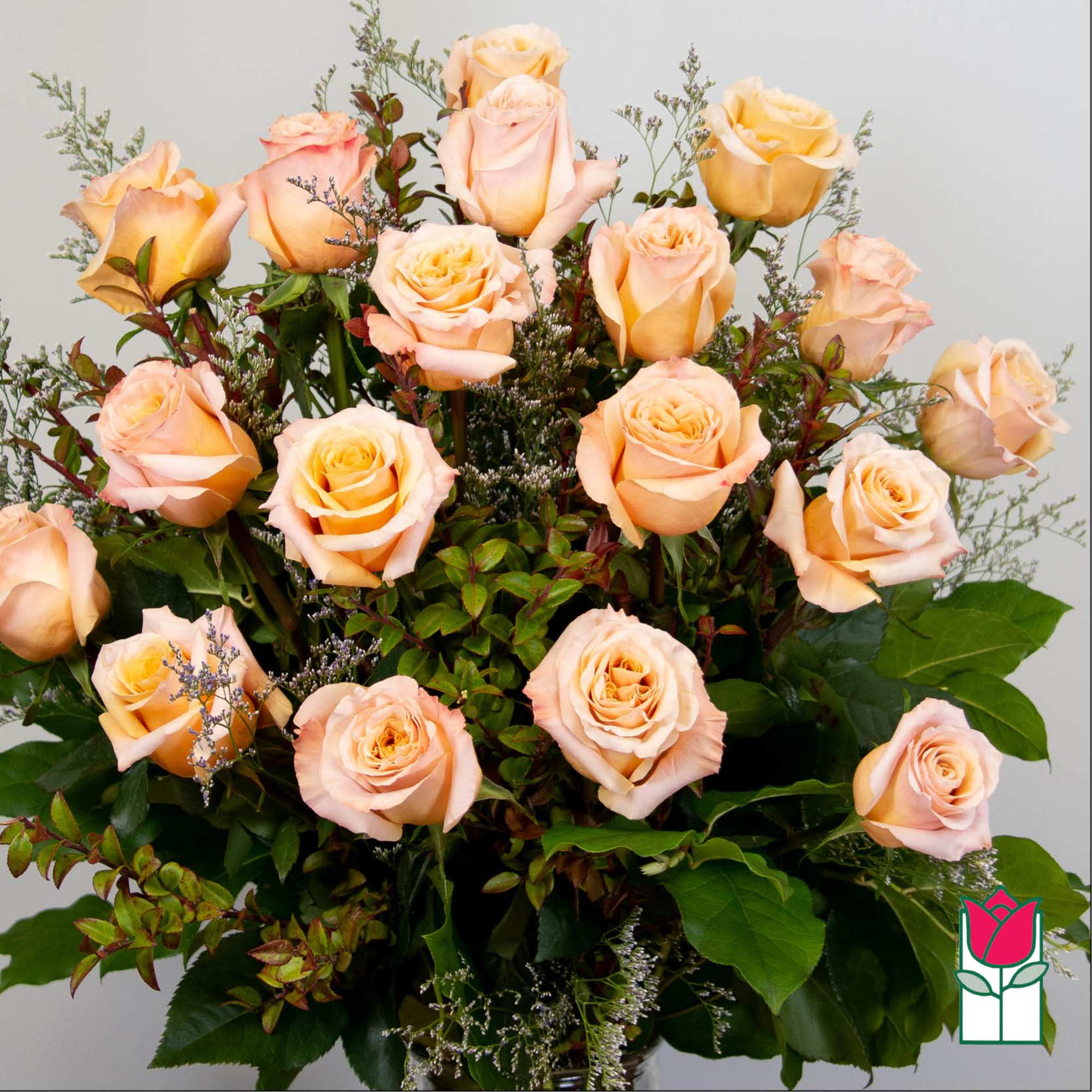 Bouquet of peach roses with greenery and filler flowers