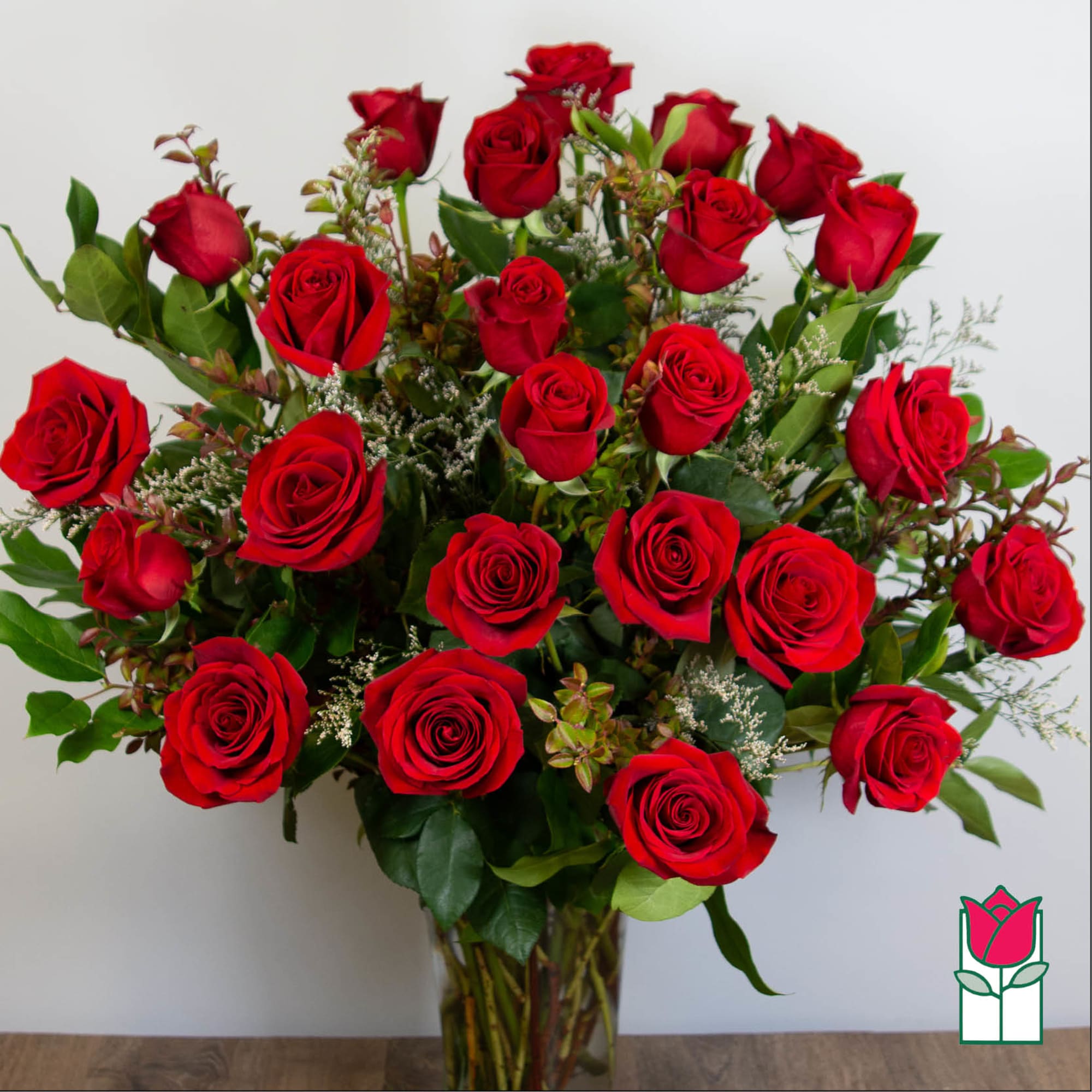 Bouquet of red roses in a clear glass vase