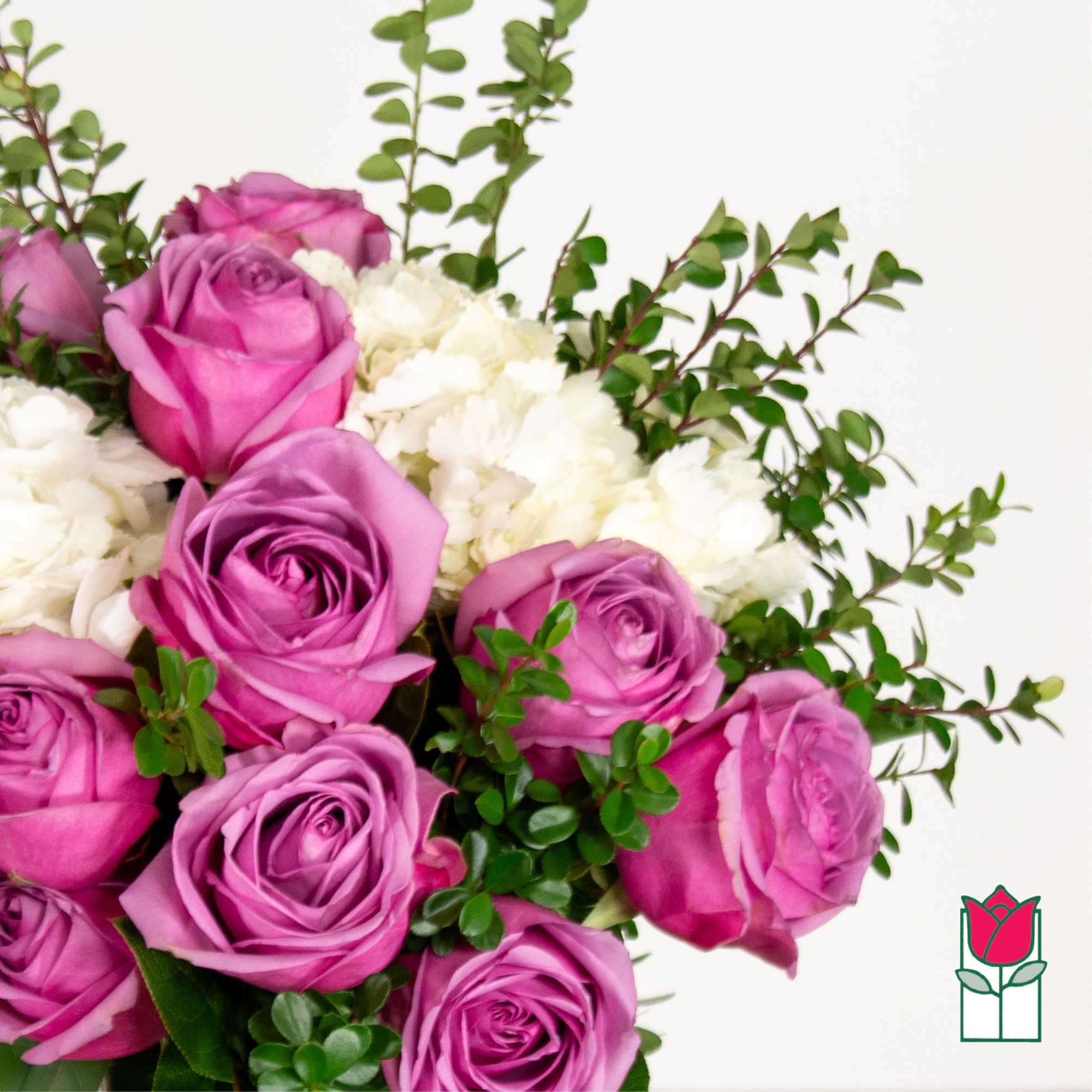 Bouquet of pink roses and white carnations with greenery