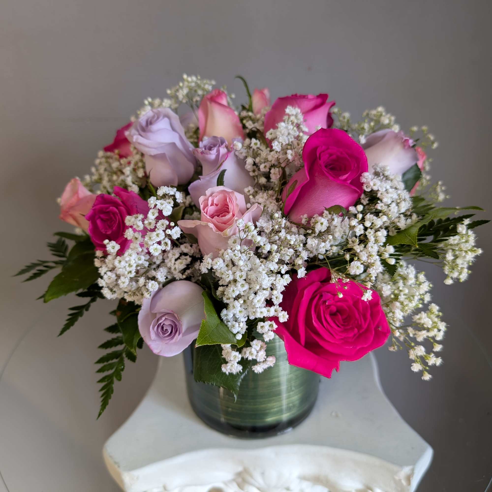This beautiful flower arrangement of fresh mixed seasonal blooms is made by