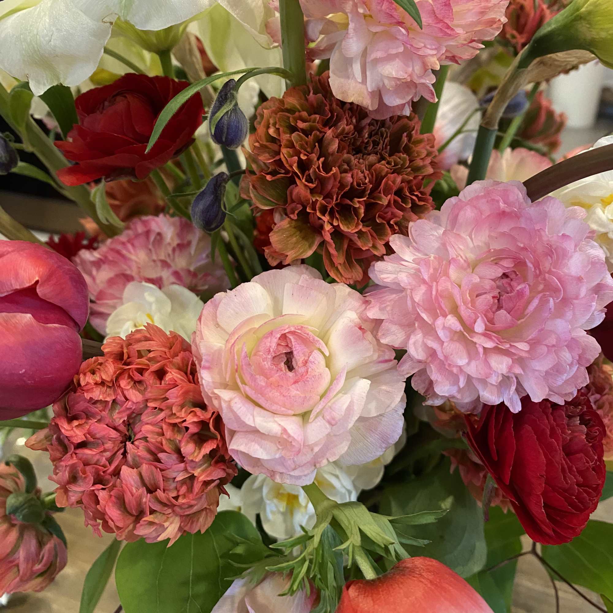 Mixed bouquet with pink, red, and white flowers