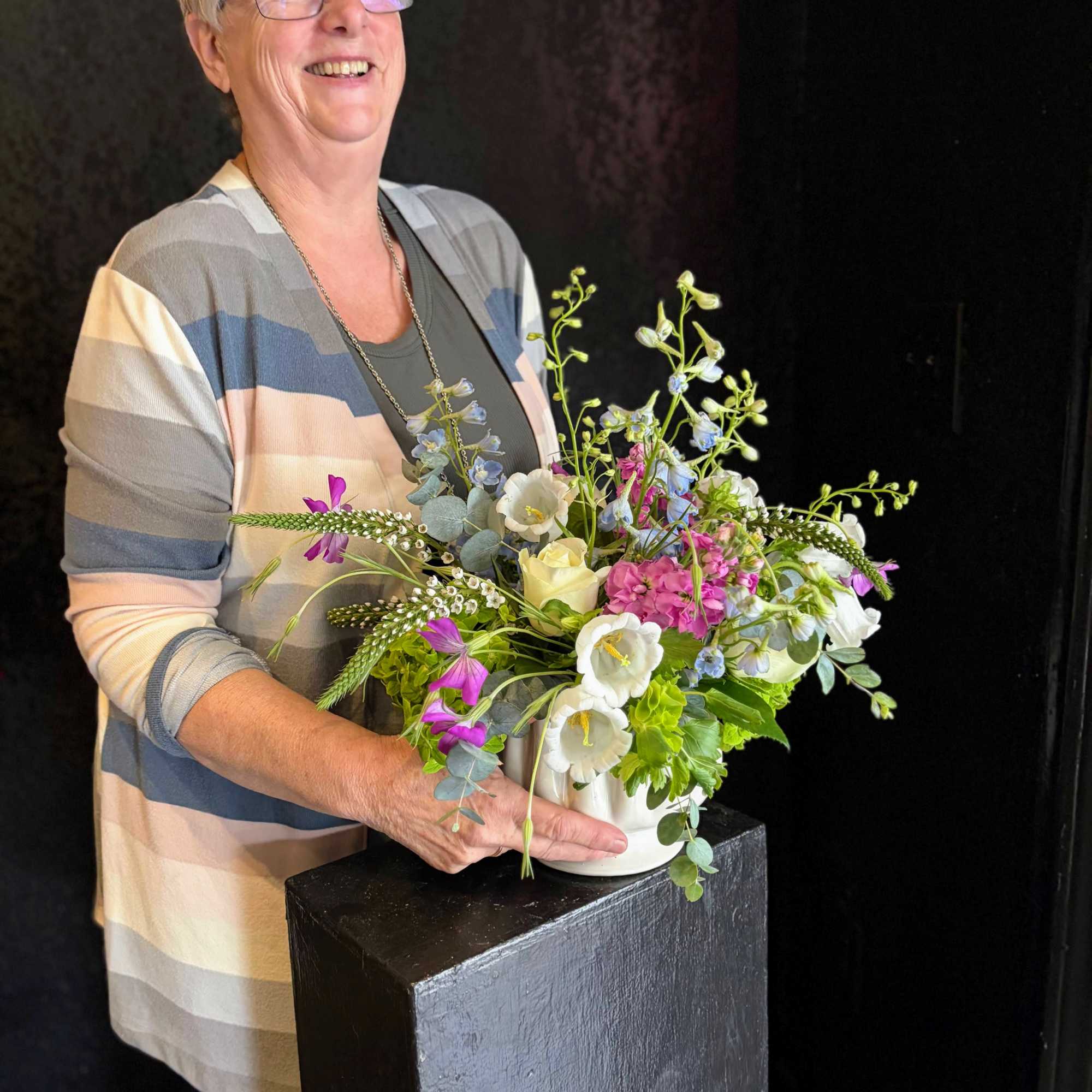 Soft Spring pastels and airy, garden-style movement make this floral arrangement the