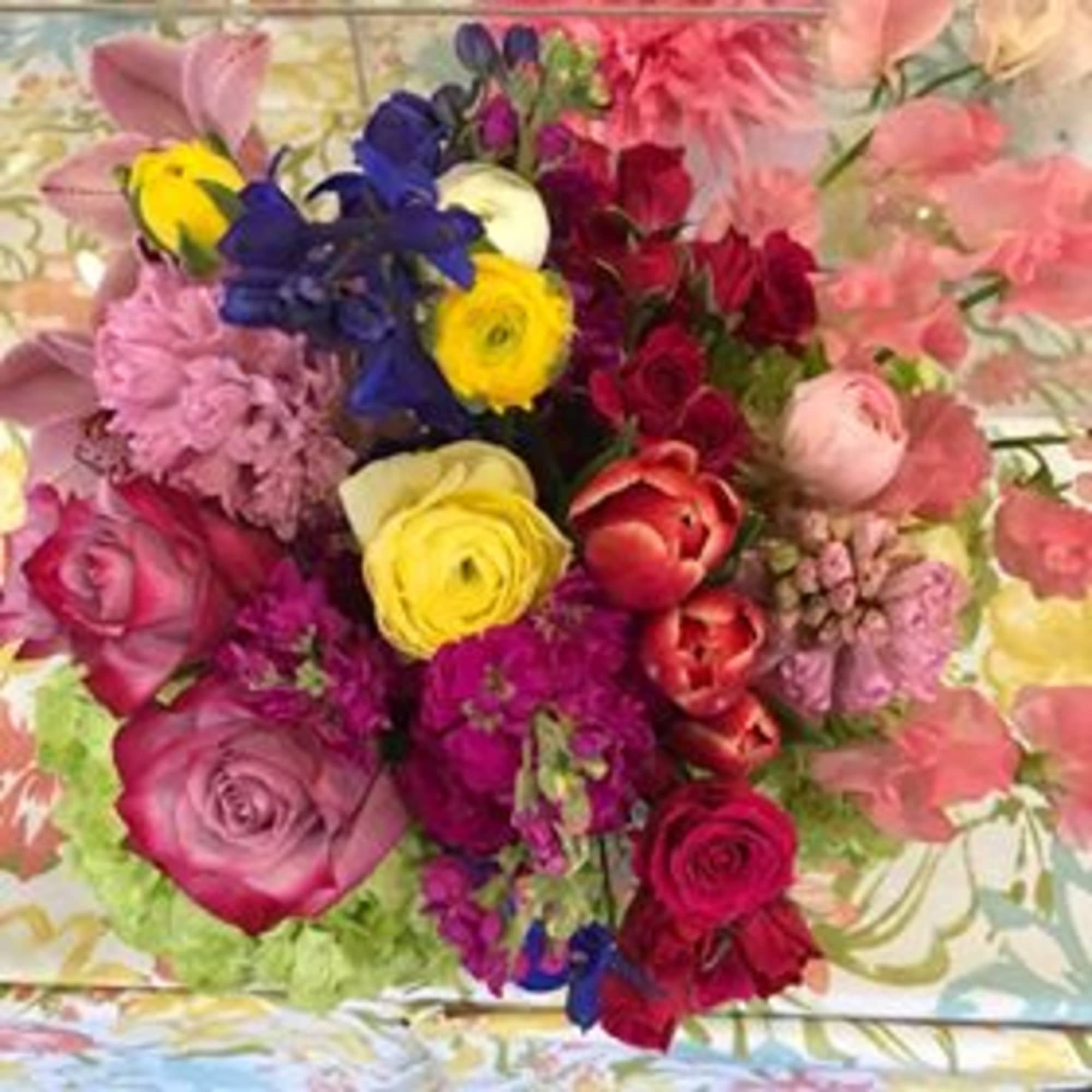 Colorful mixed bouquet with roses, tulips, and ranunculus