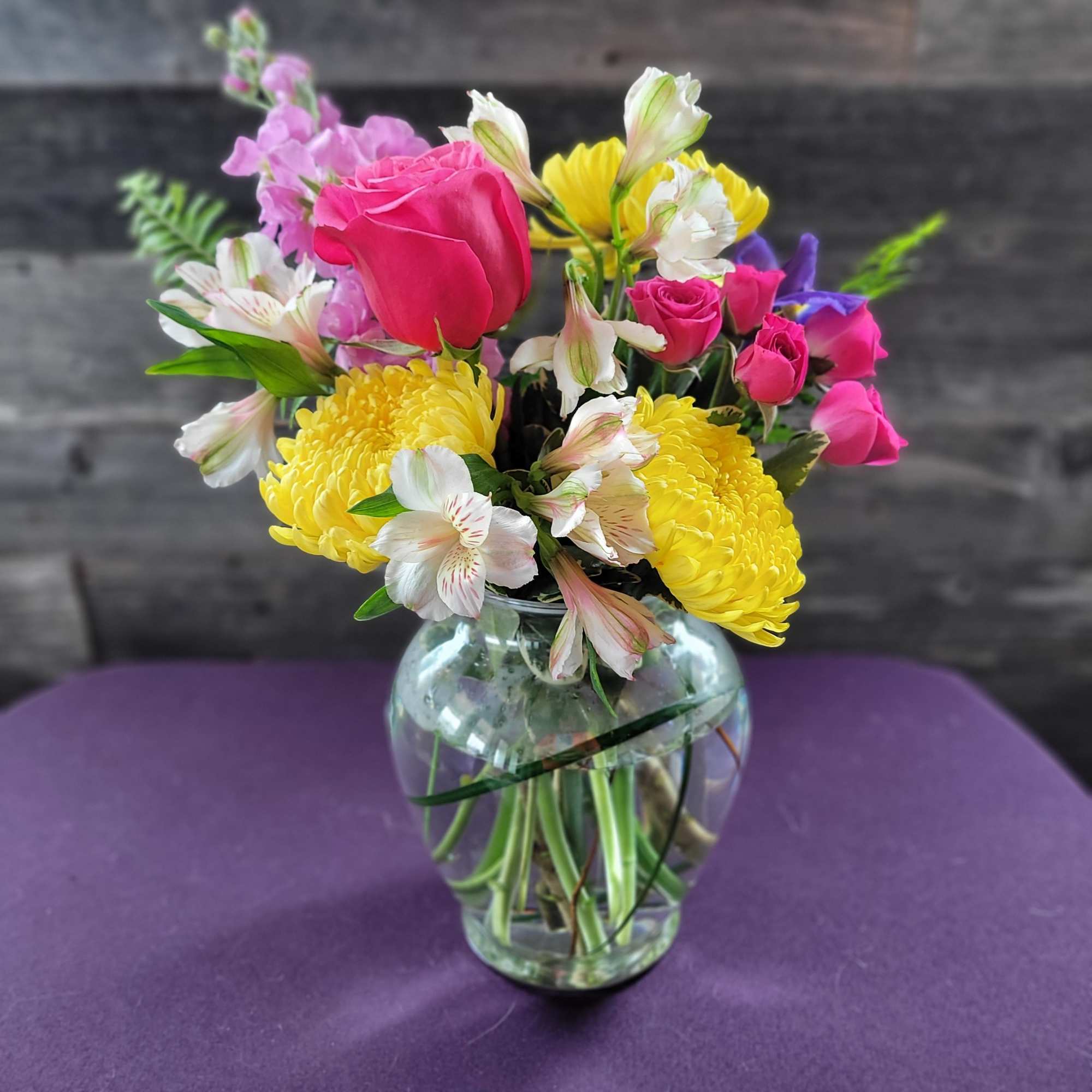 Cute  little bright and cheery arrangement that will brighten anyone's day.