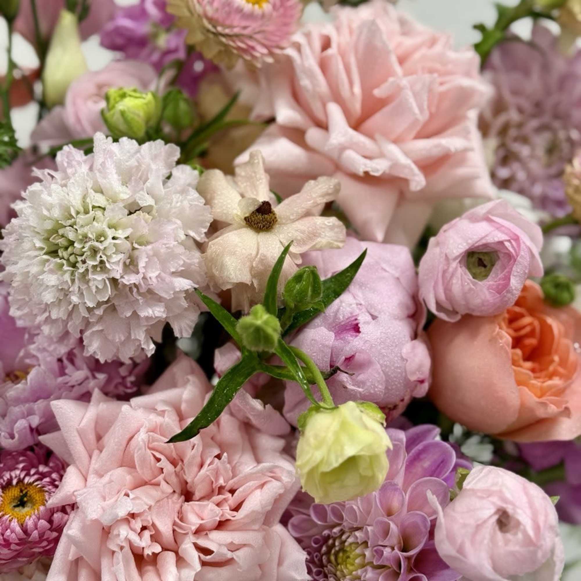 Pastel bouquet with pink and lavender flowers in a close-up arrangement