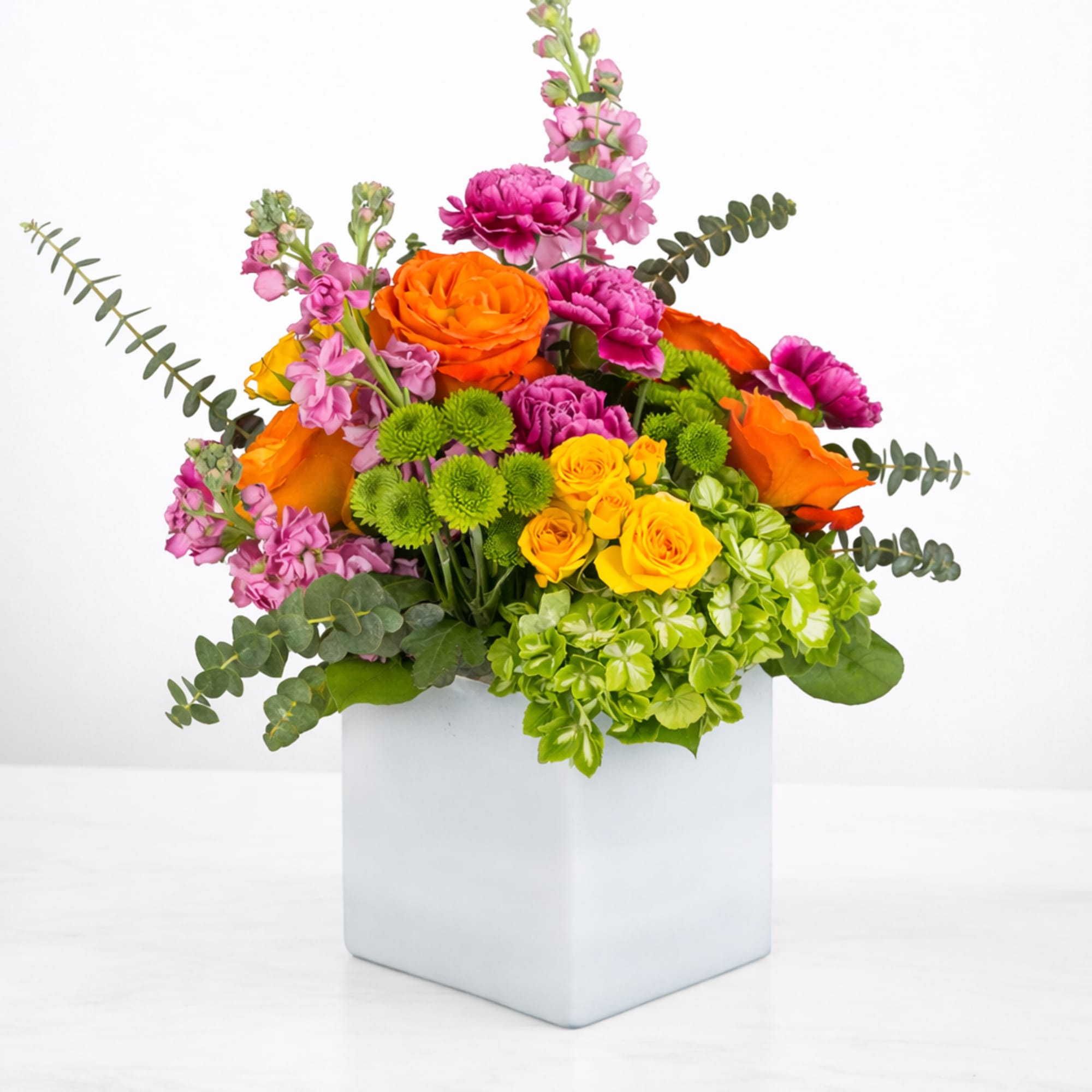 Turn up the heat with the vivacious bouquet. This arrangement includes roses