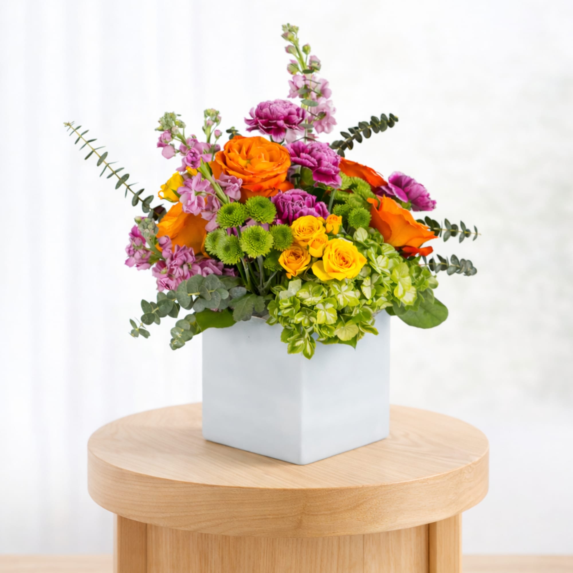 Turn up the heat with the vivacious bouquet. This arrangement includes roses