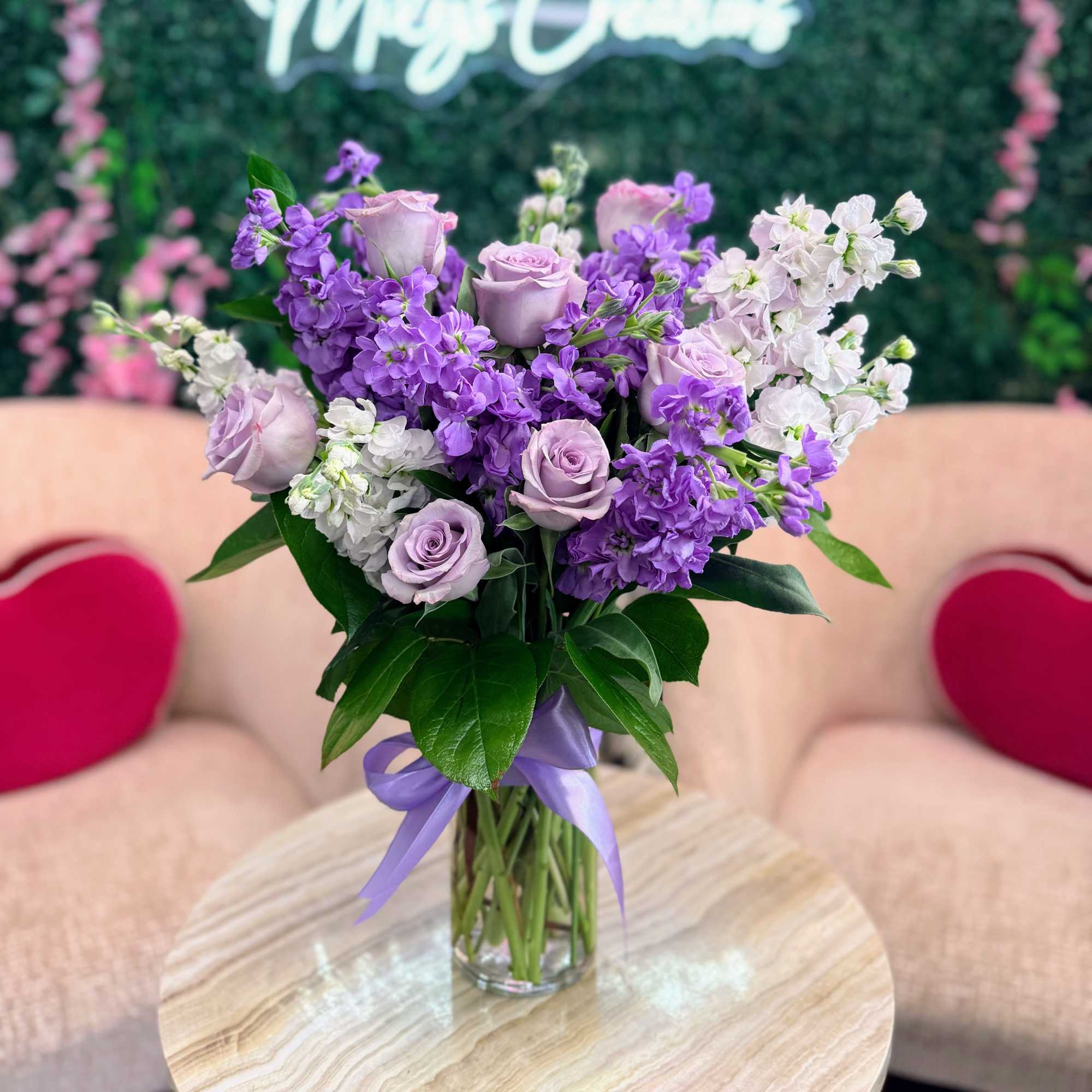 A soft and elegant arrangement featuring delicate lavender looms. Designed in a