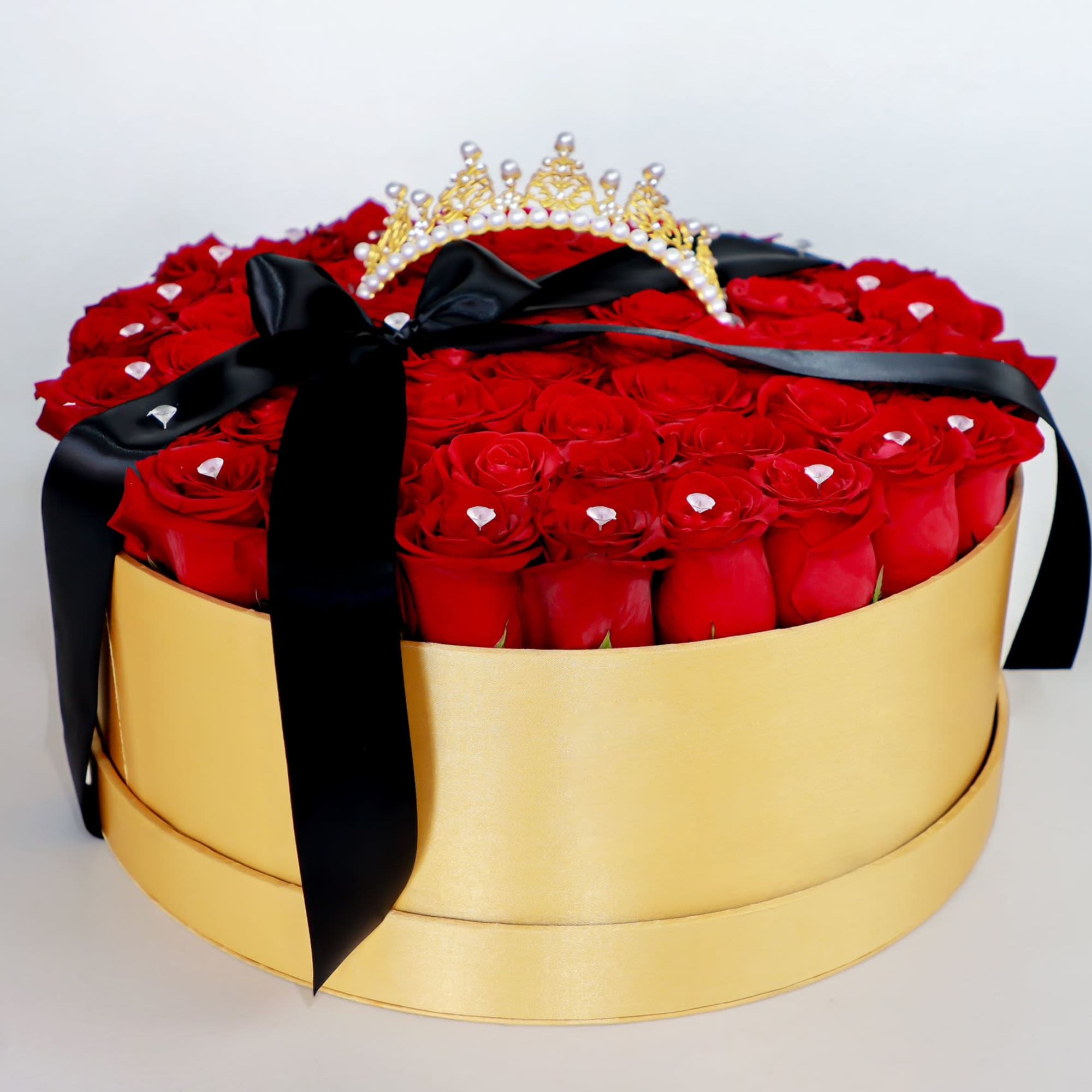 The roses are tightly arranged for a full, polished dome set inside