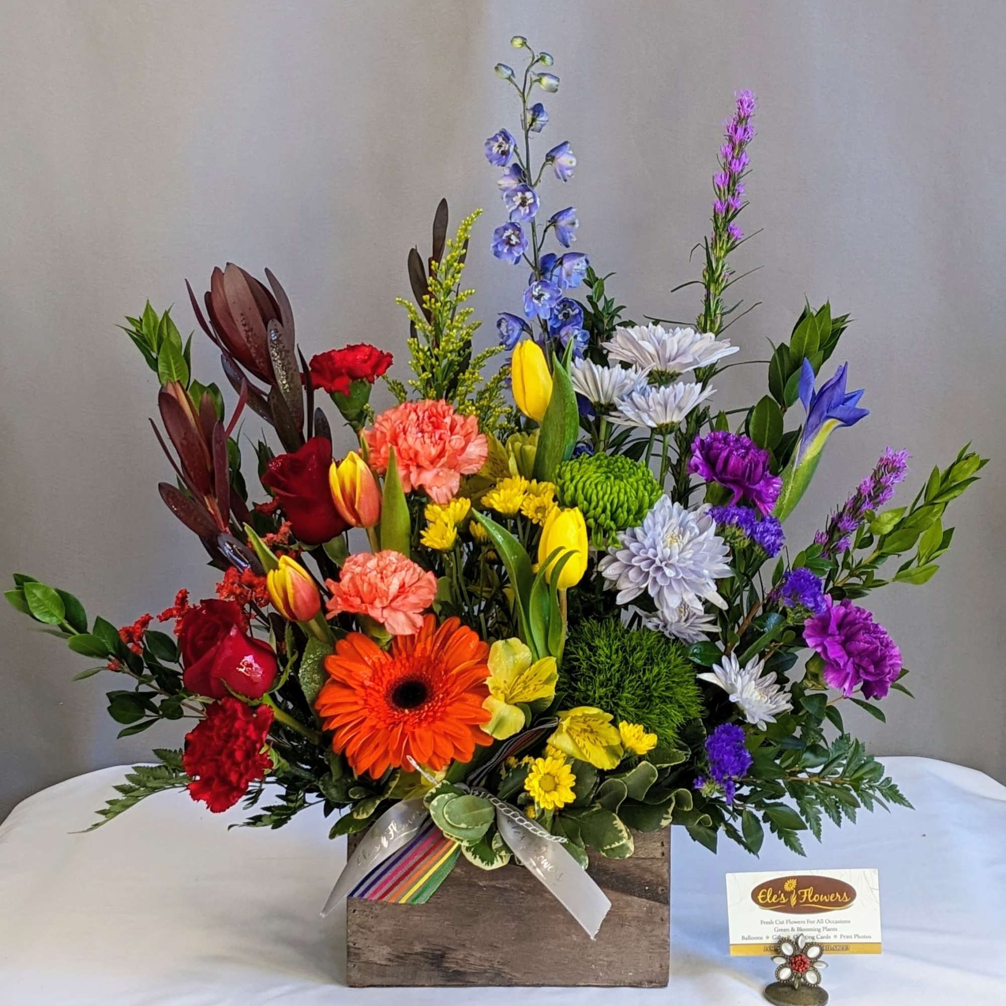 Express your heartfelt condolences with our Colorful Sympathy Blooms arrangement. This exquisite