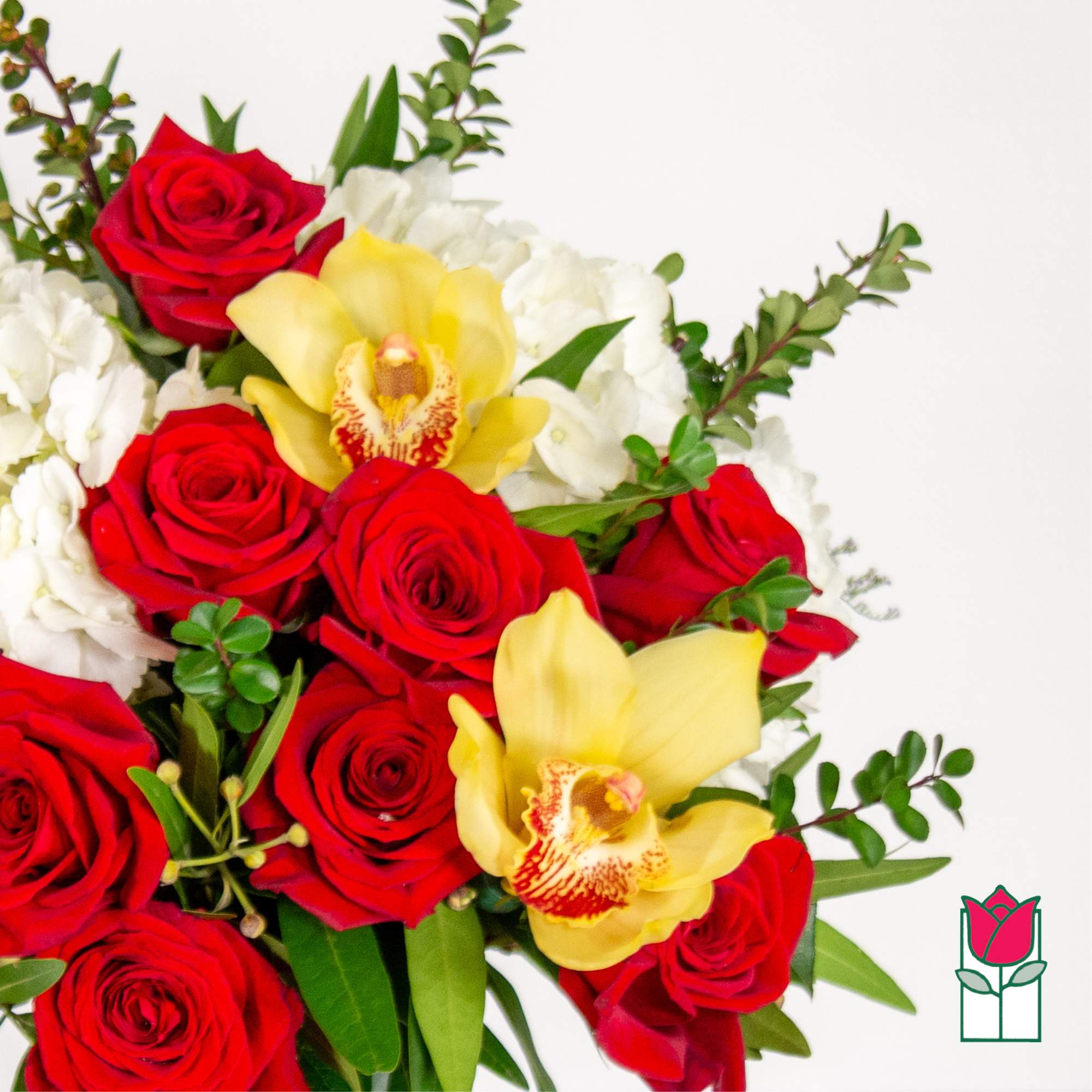 Bouquet of red roses, yellow orchids, and white flowers
