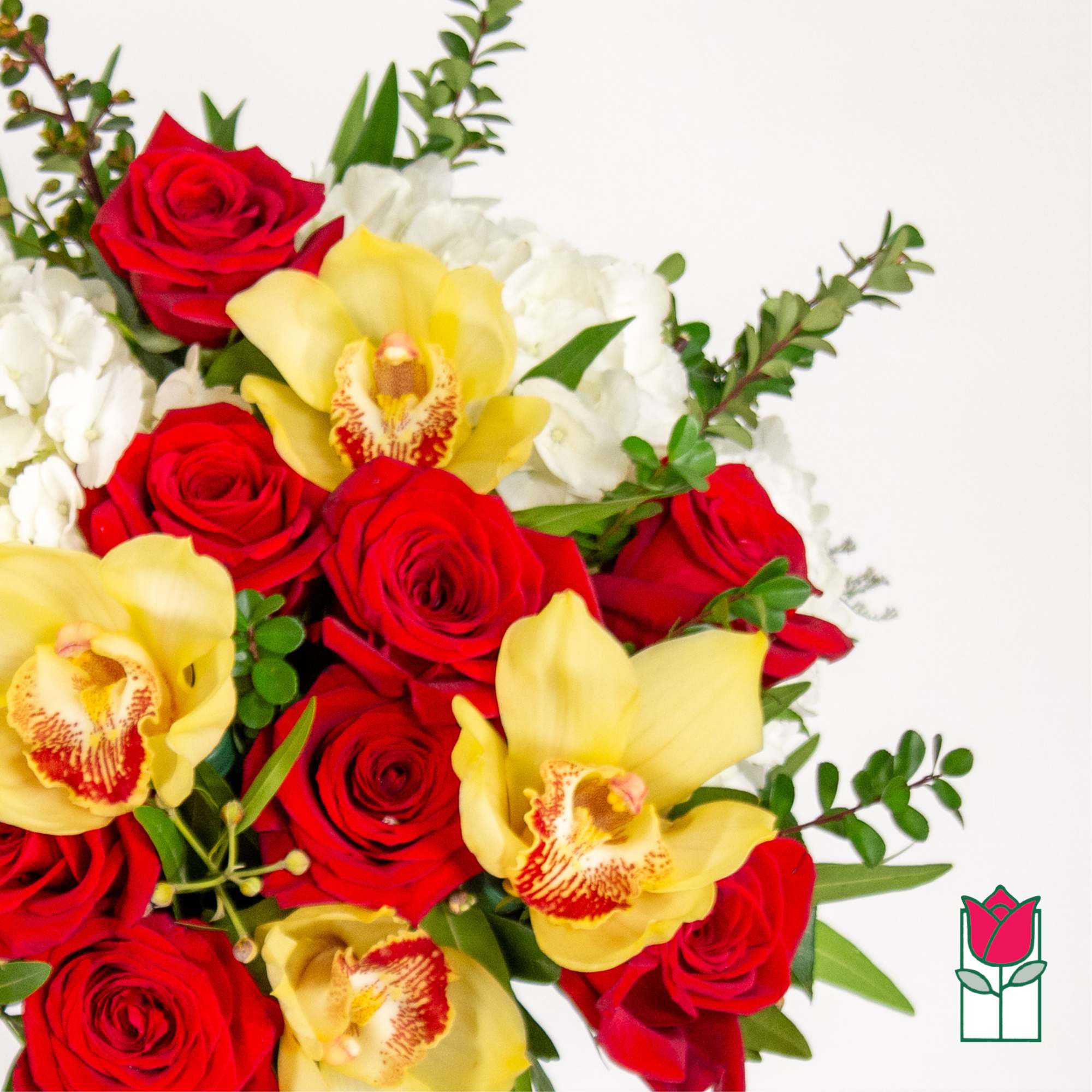 Bouquet of red roses, yellow orchids, and white flowers