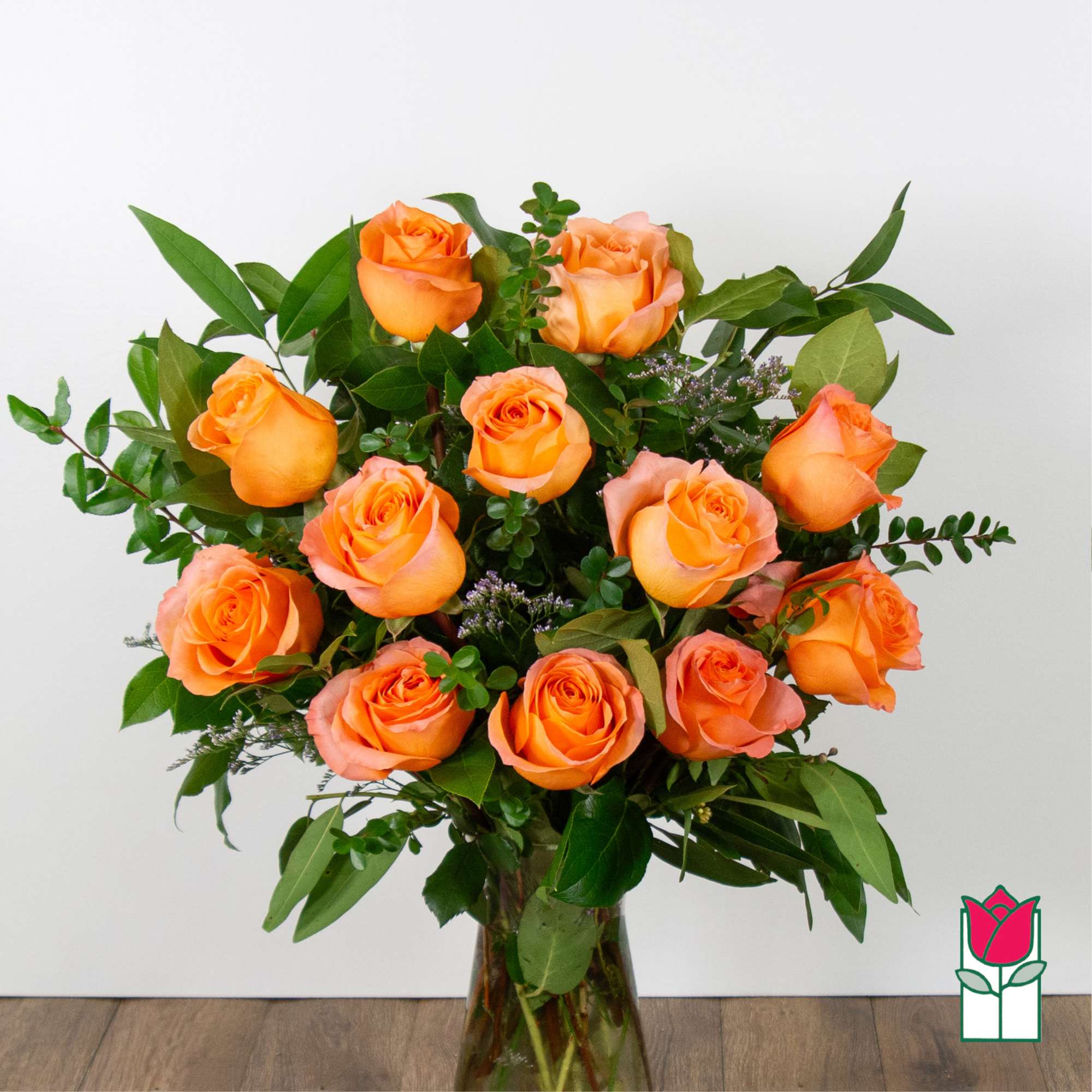 Bouquet of orange roses in a glass vase