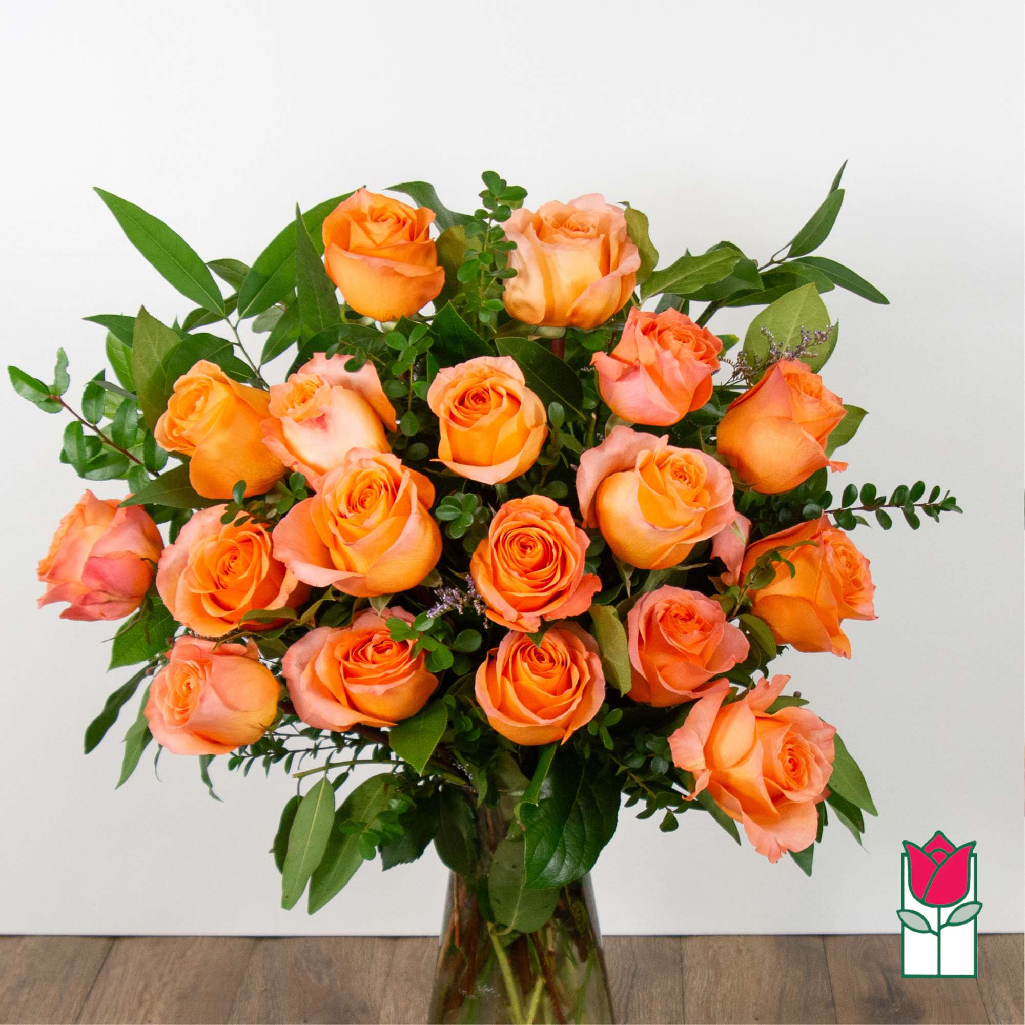 Bouquet of orange roses in a glass vase
