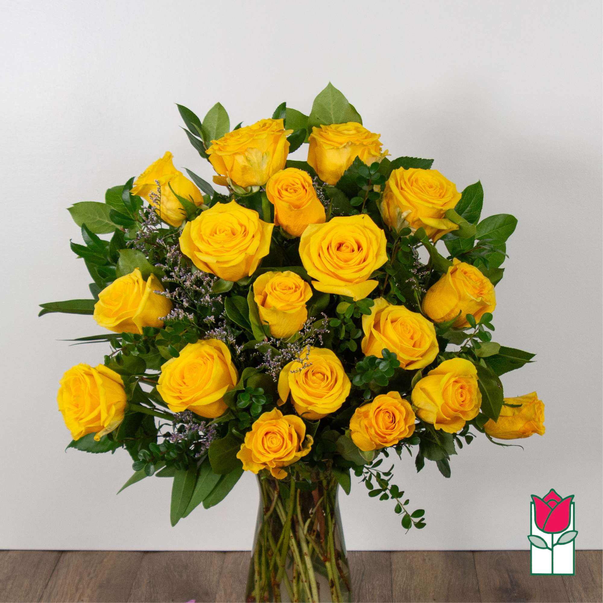 Bouquet of yellow roses in a clear glass vase