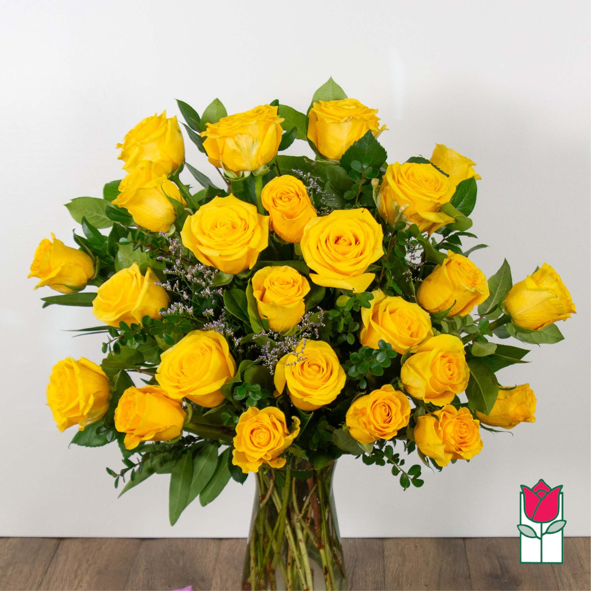 Bouquet of yellow roses in a clear glass vase