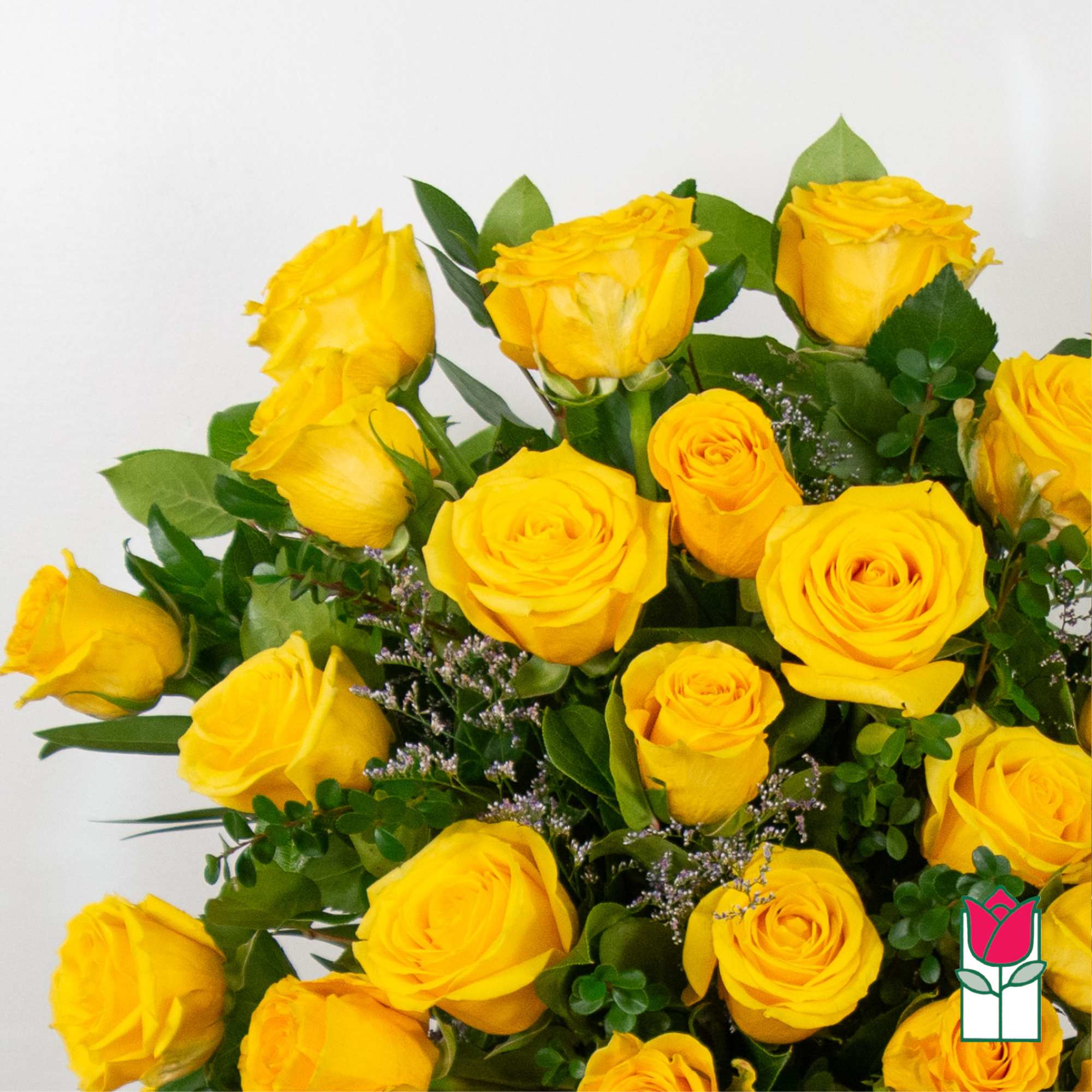 Bouquet of yellow roses with green foliage and small purple filler flowers