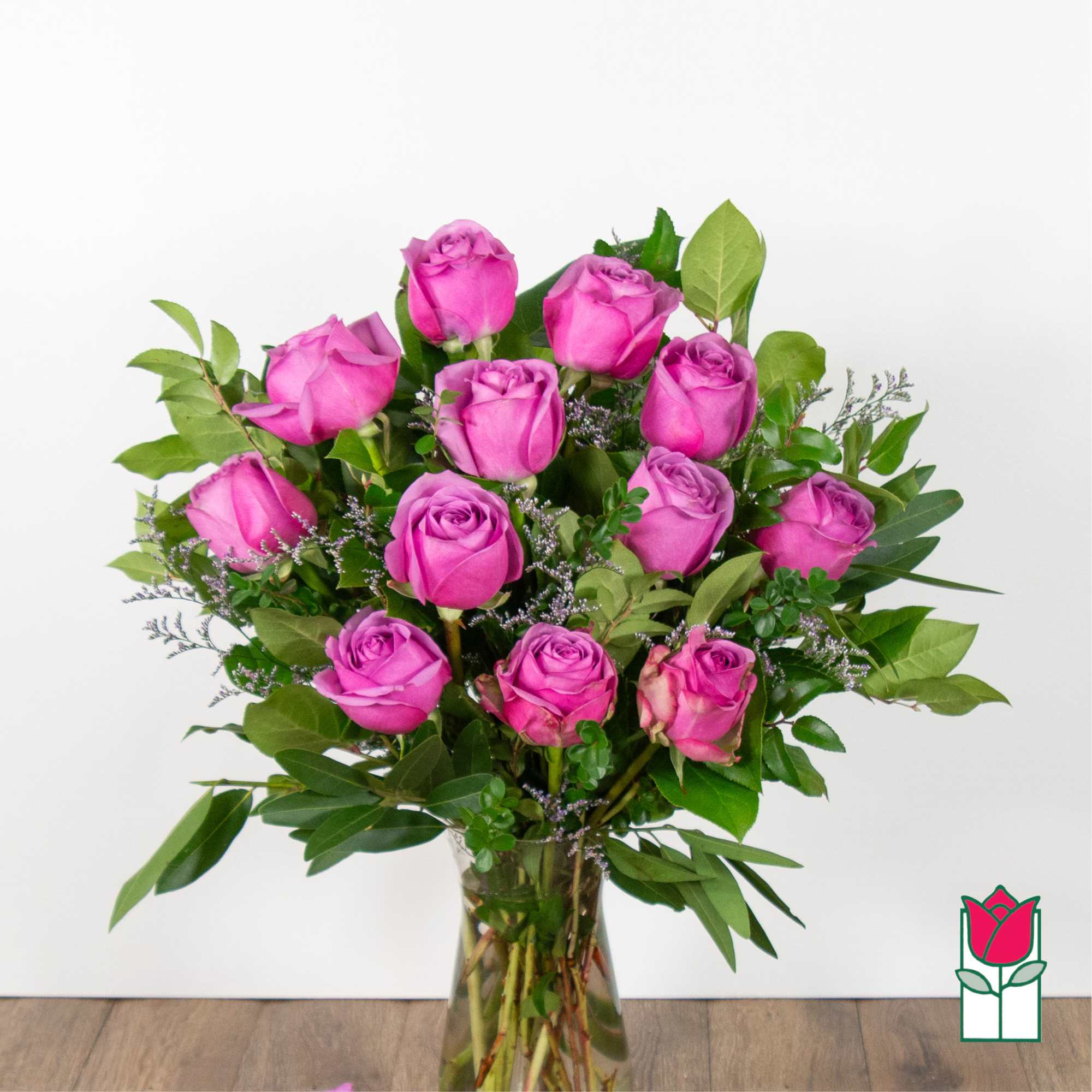 Bouquet of pink roses in a clear glass vase