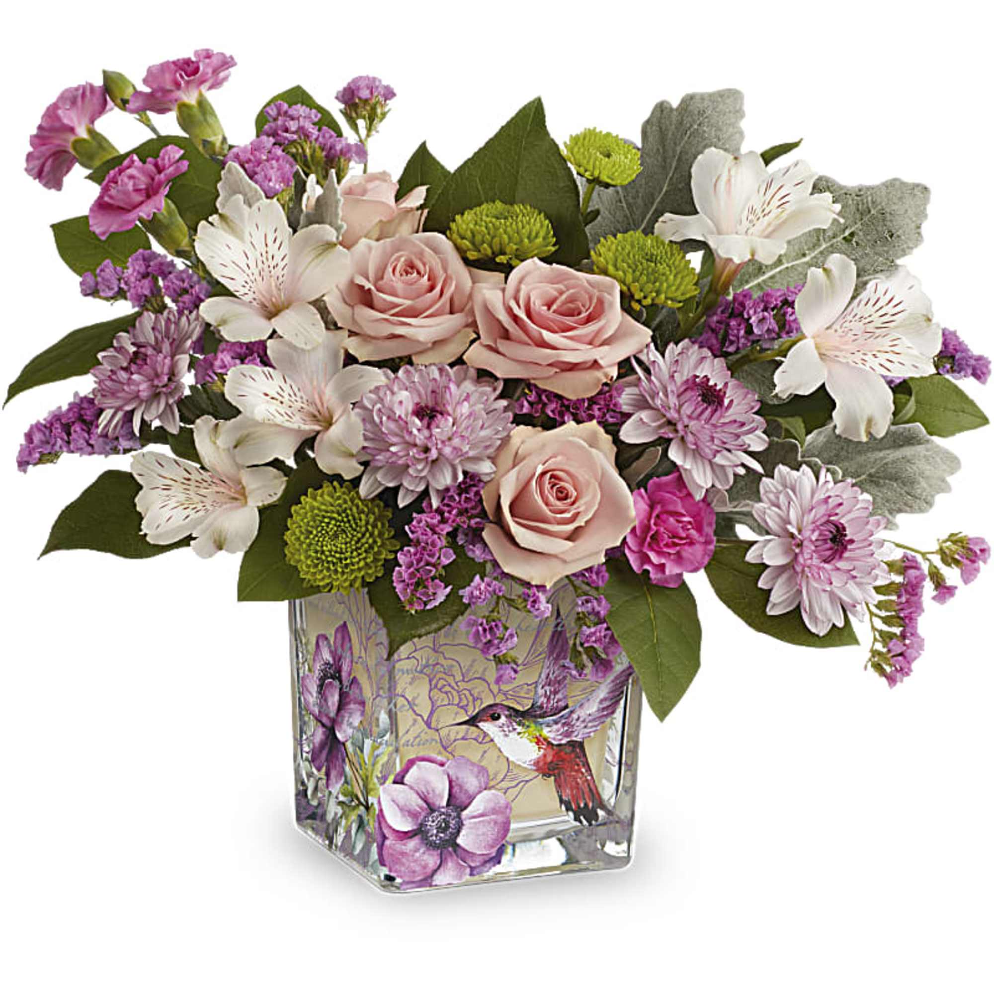 Pink roses, white alstroemeria, and purple mums in a square glass vase with a hummingbird design