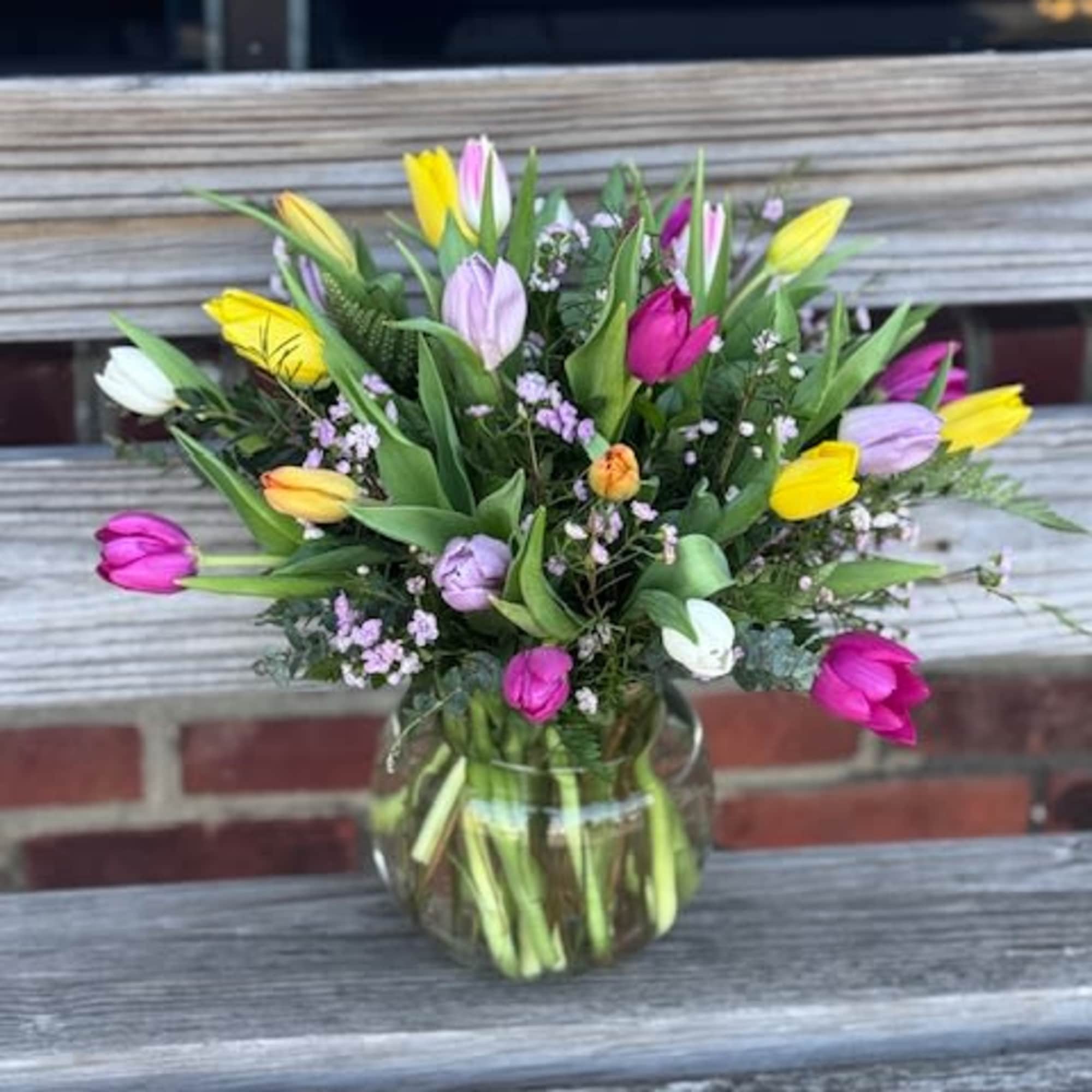 1 dozen assorted tulips, colors based on availability.