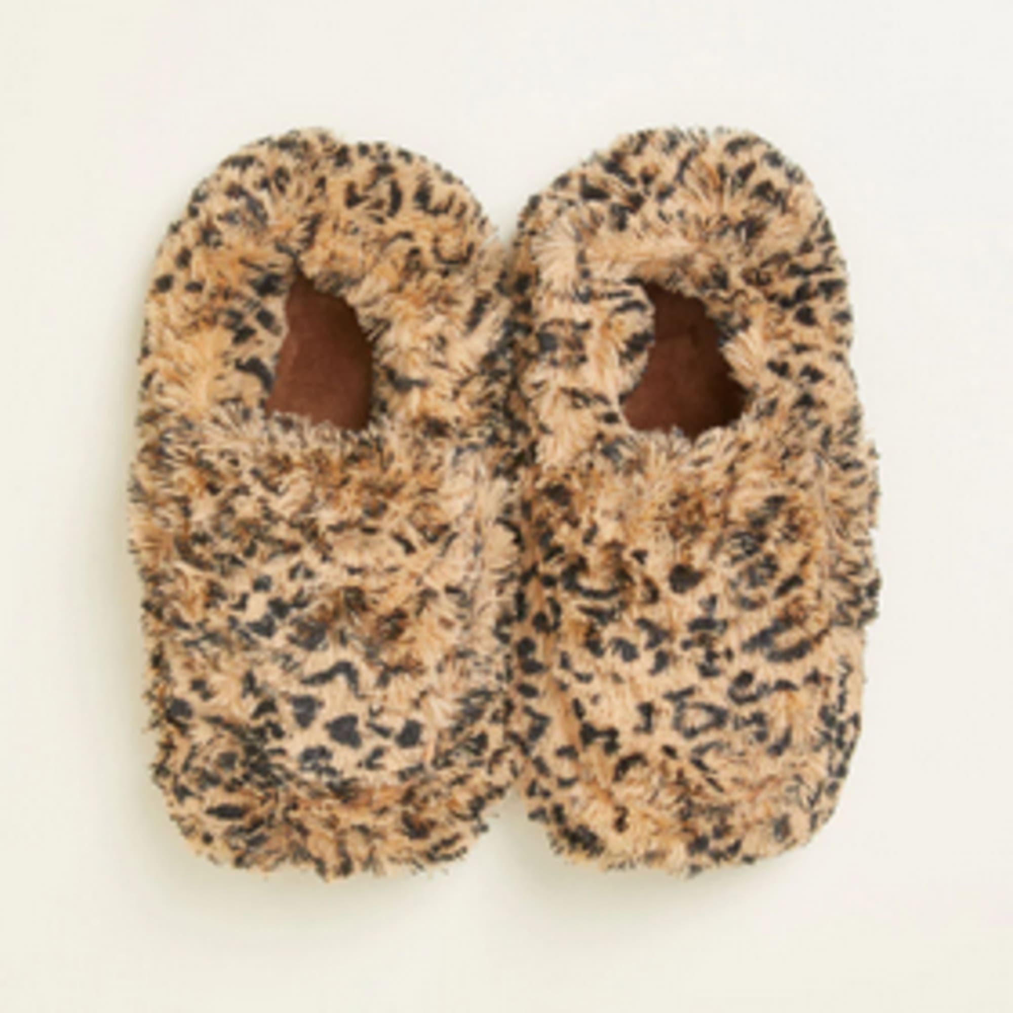 Pair of leopard-print fuzzy slippers on a light background