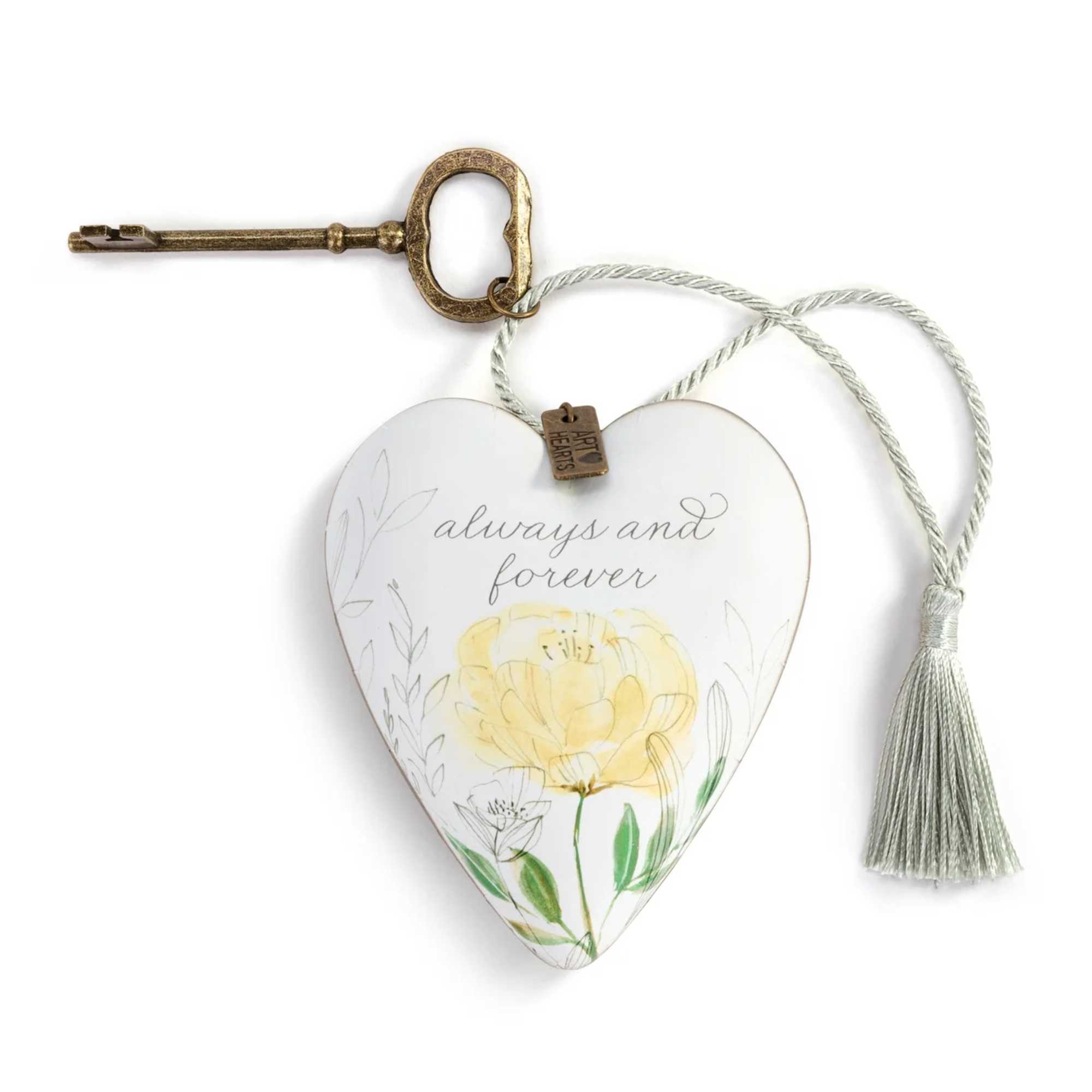 Heart-shaped hanging ornament with a key and tassel