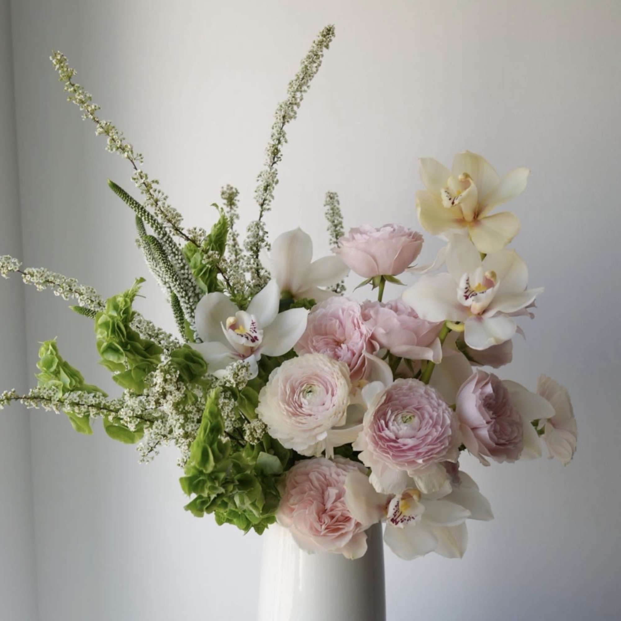 A refined floral composition in soft pink tones, designed with a modern
