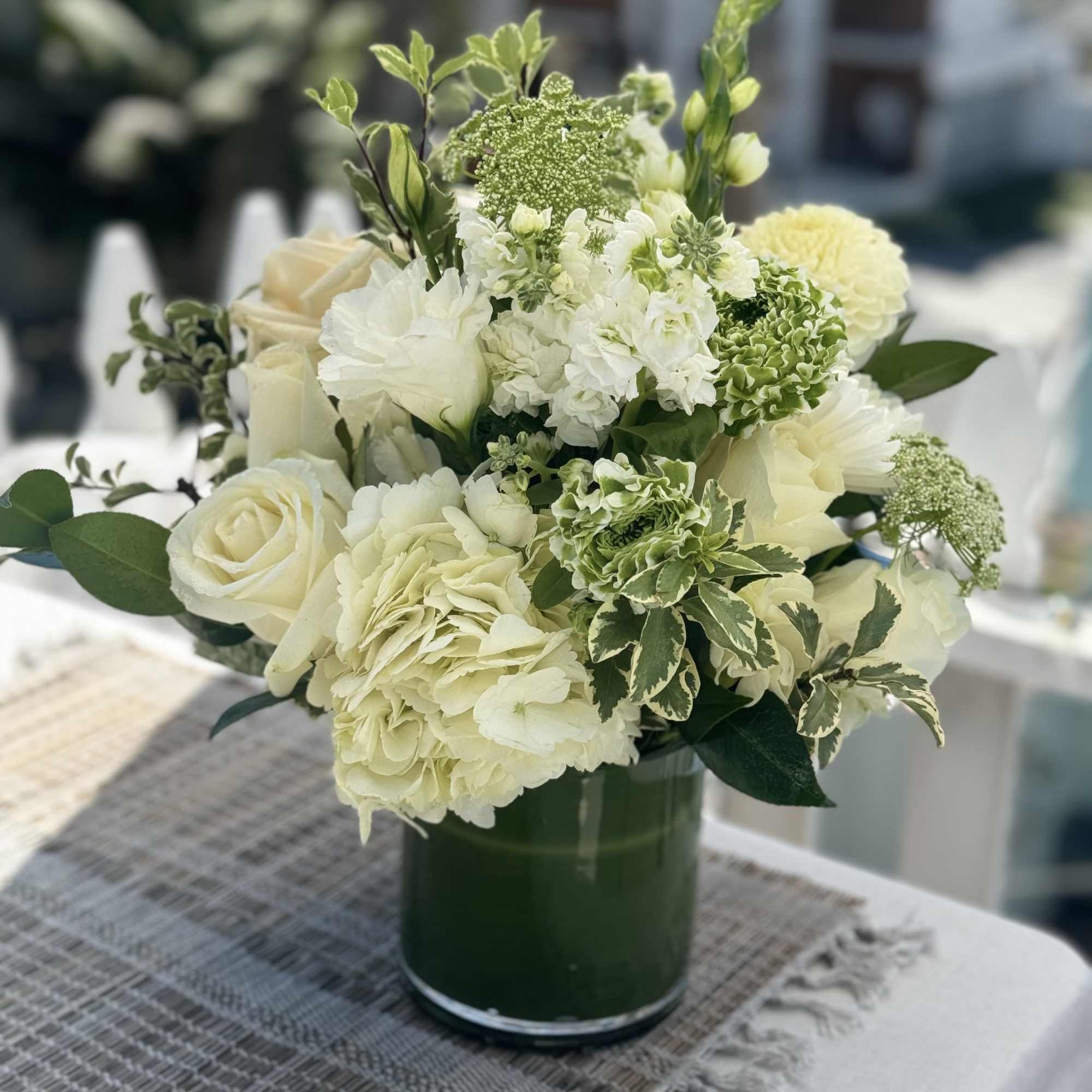 This beautiful whites and green design is anything but simple. It&rsquo;s elegant