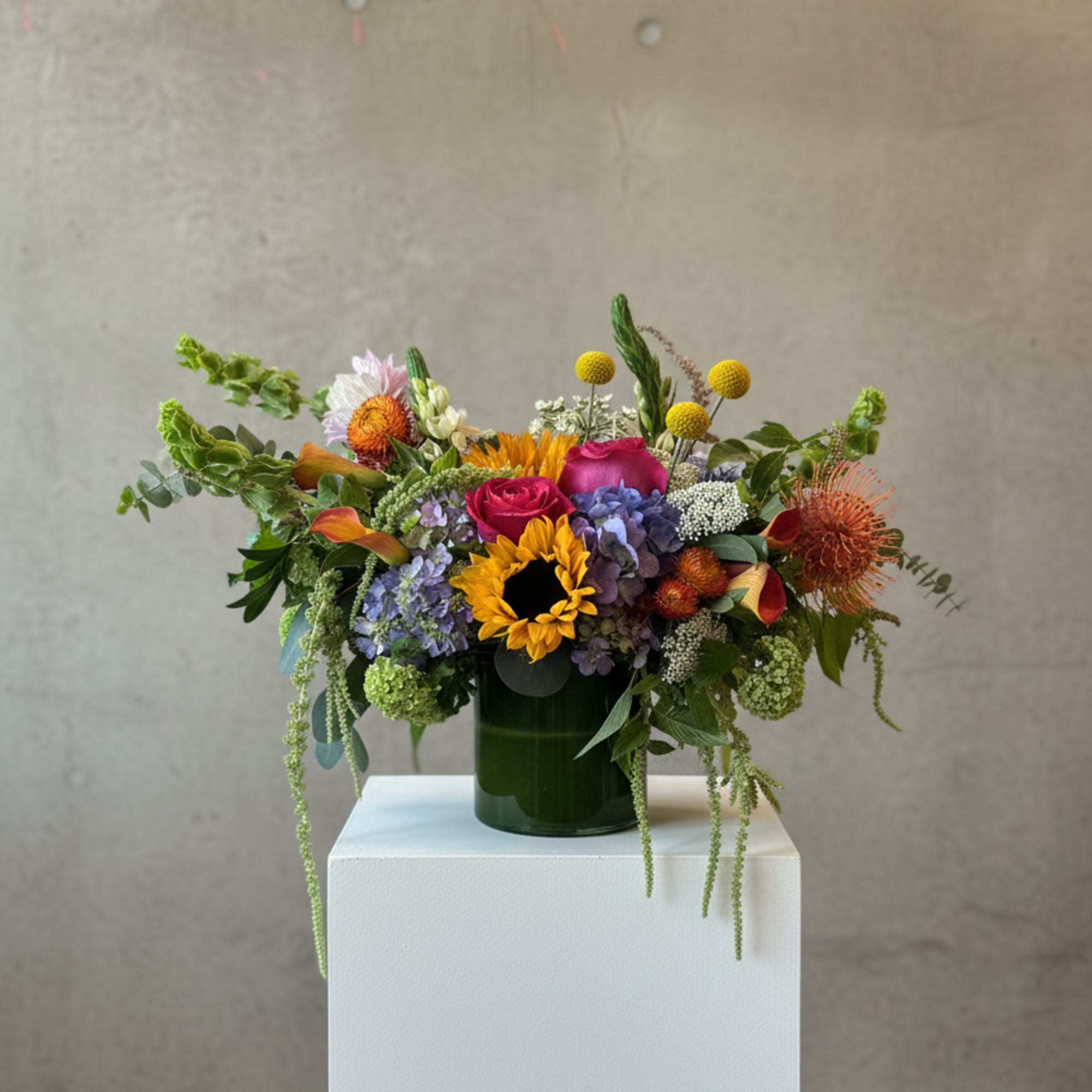 Bright, garden-fresh color greets the recipient with this Farm Fresh flower arrangement