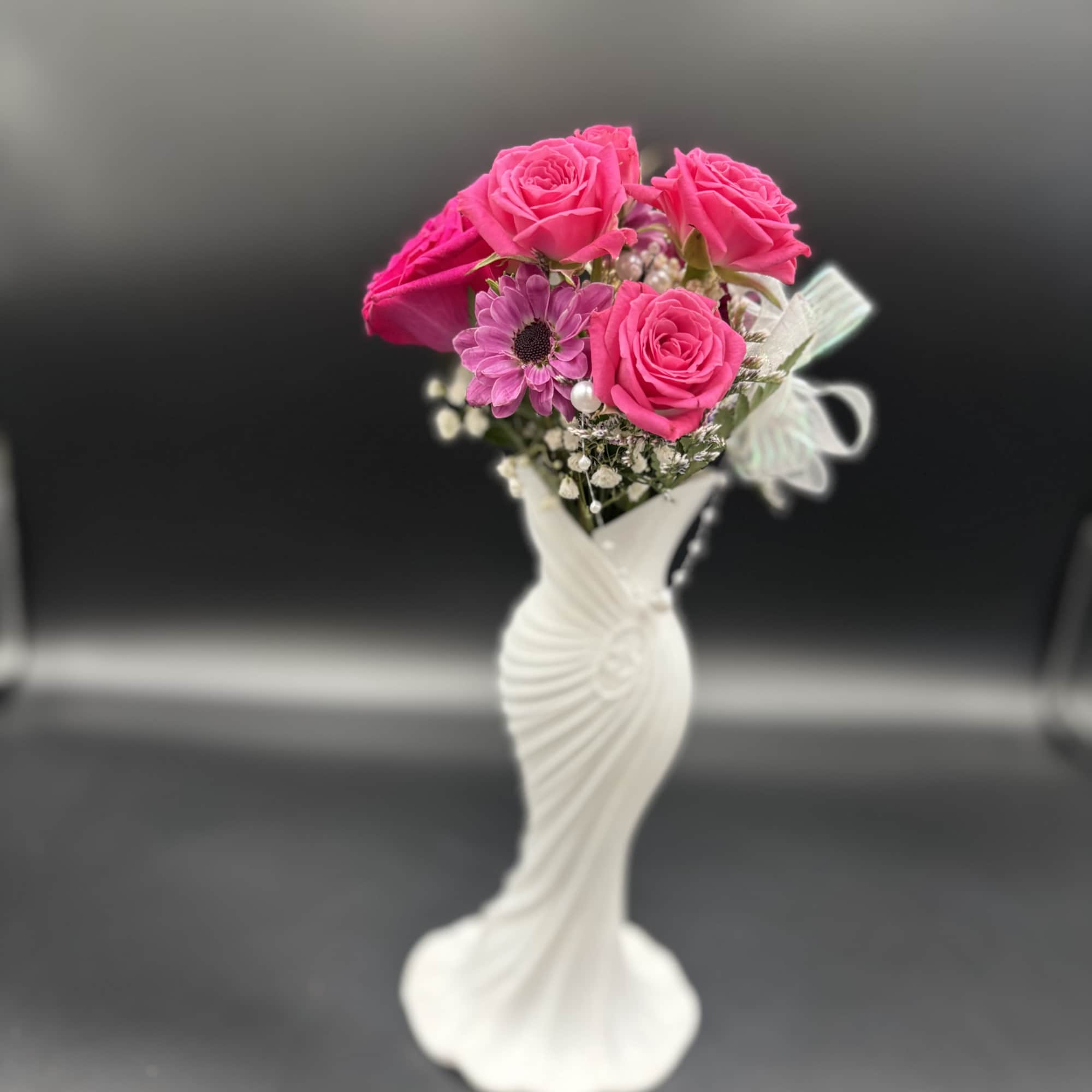 Fresh floral in plastic vase 