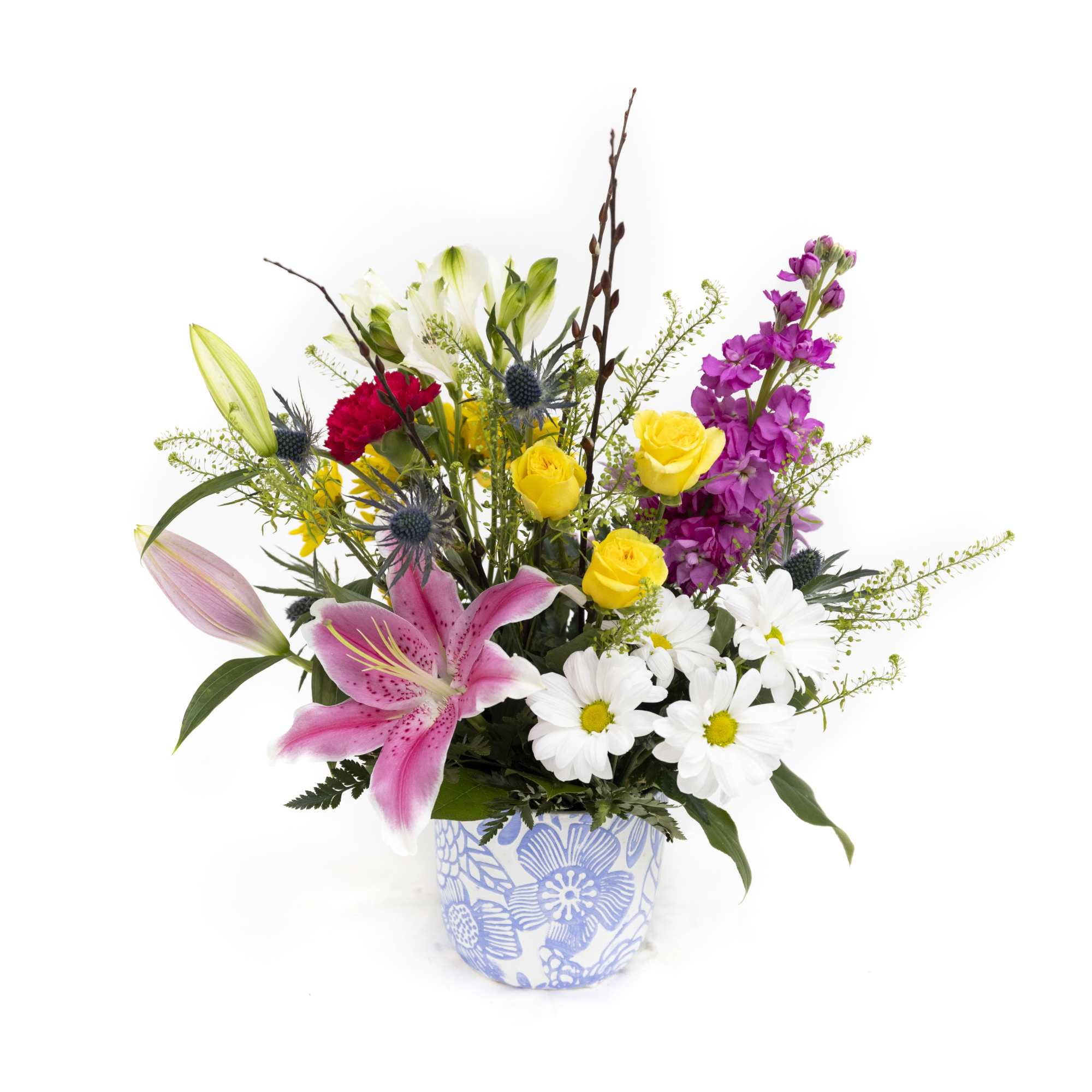 Mixed bouquet in a blue floral pot with pink lily and yellow roses