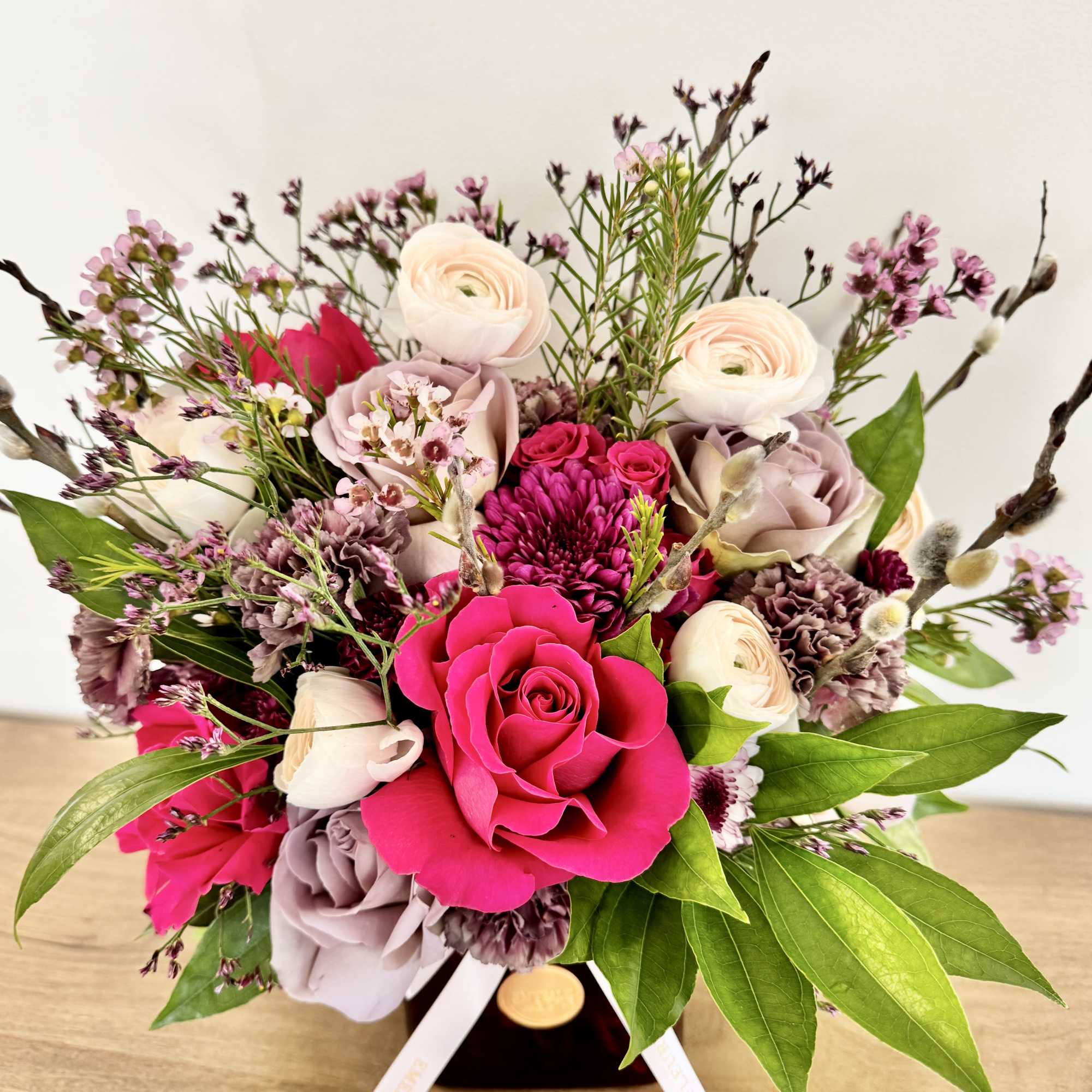 Ruby Femme is a confident and romantic floral design arranged in red