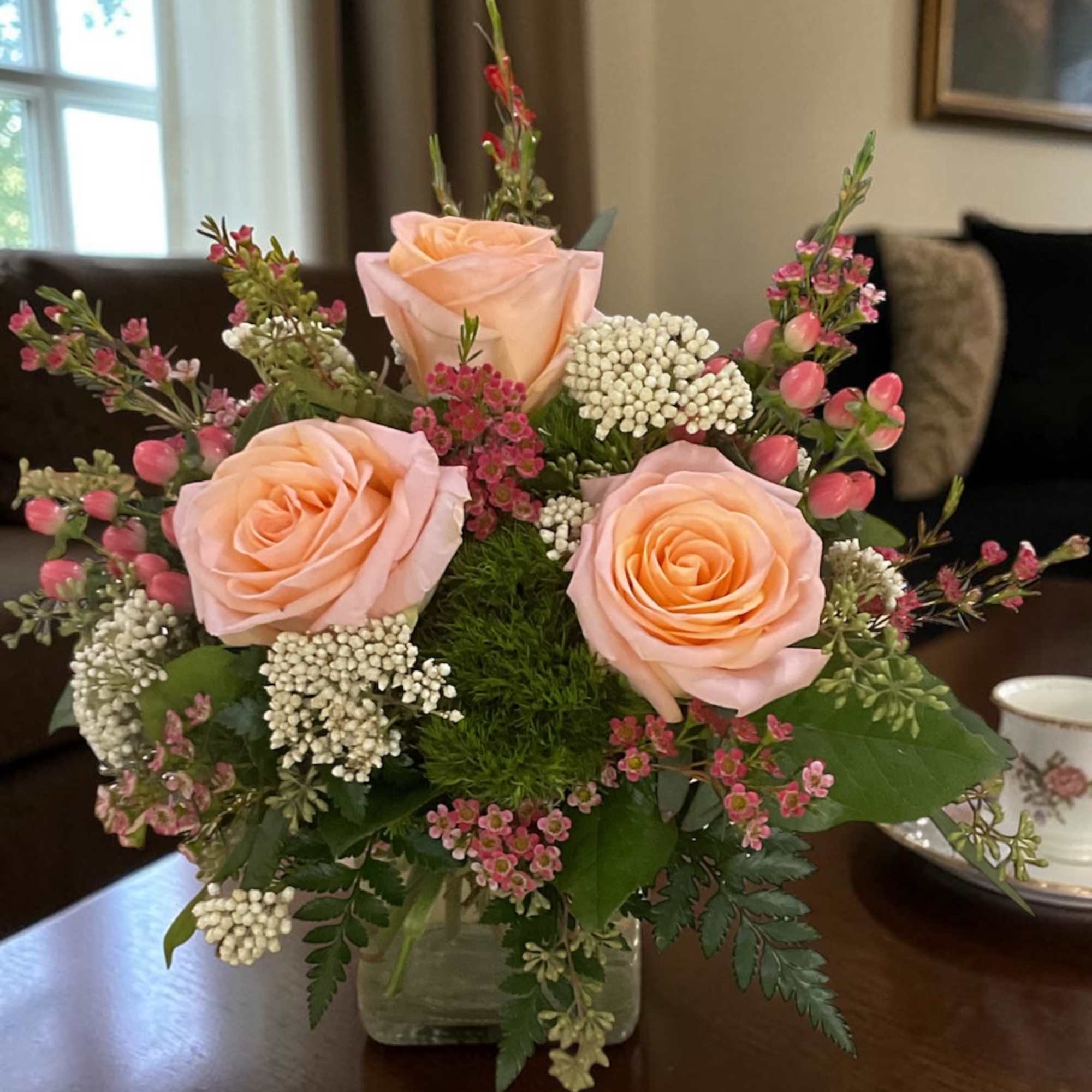 Peach Darling is a fresh, garden-style floral arrangement built around soft peach