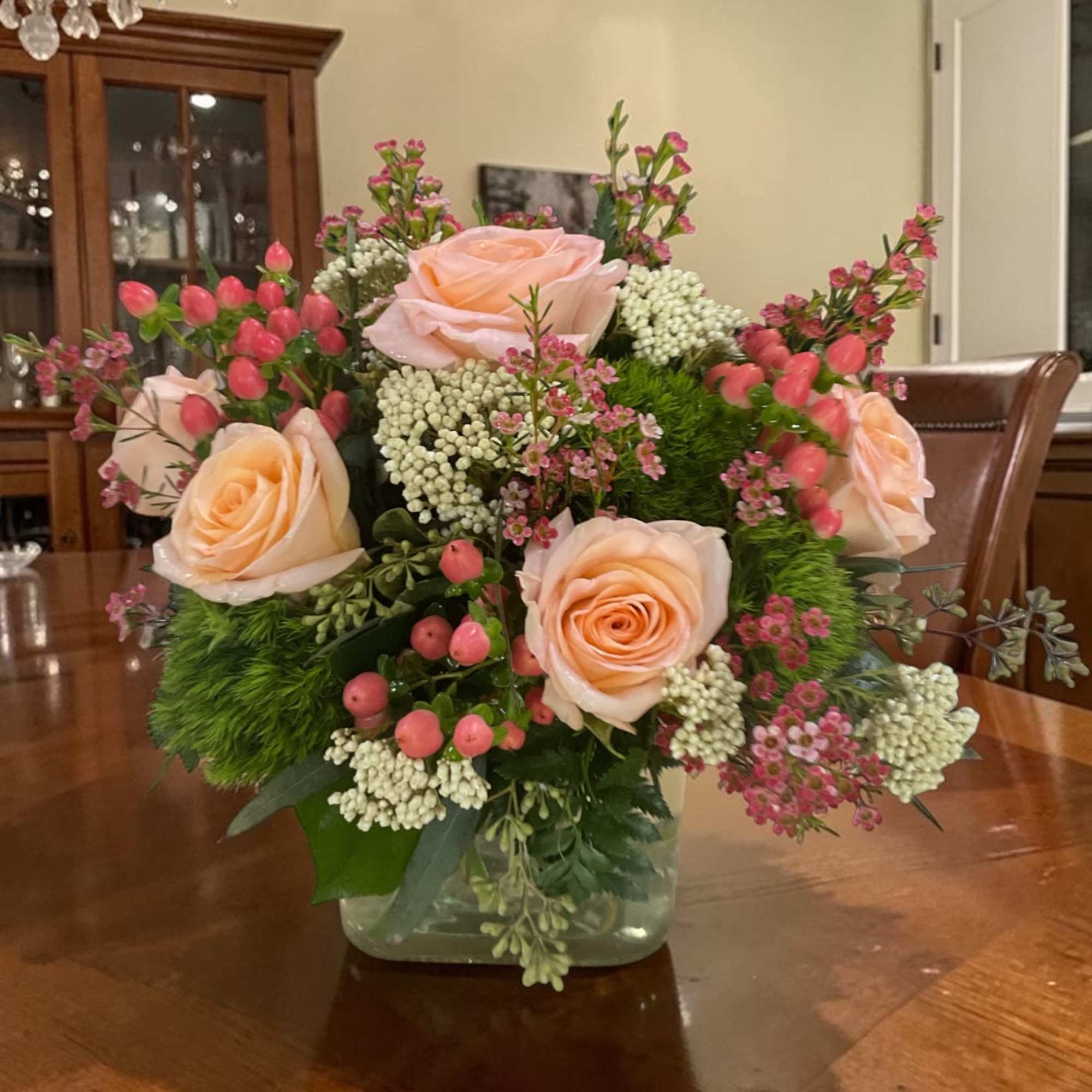 Peach Darling is a fresh, garden-style floral arrangement built around soft peach