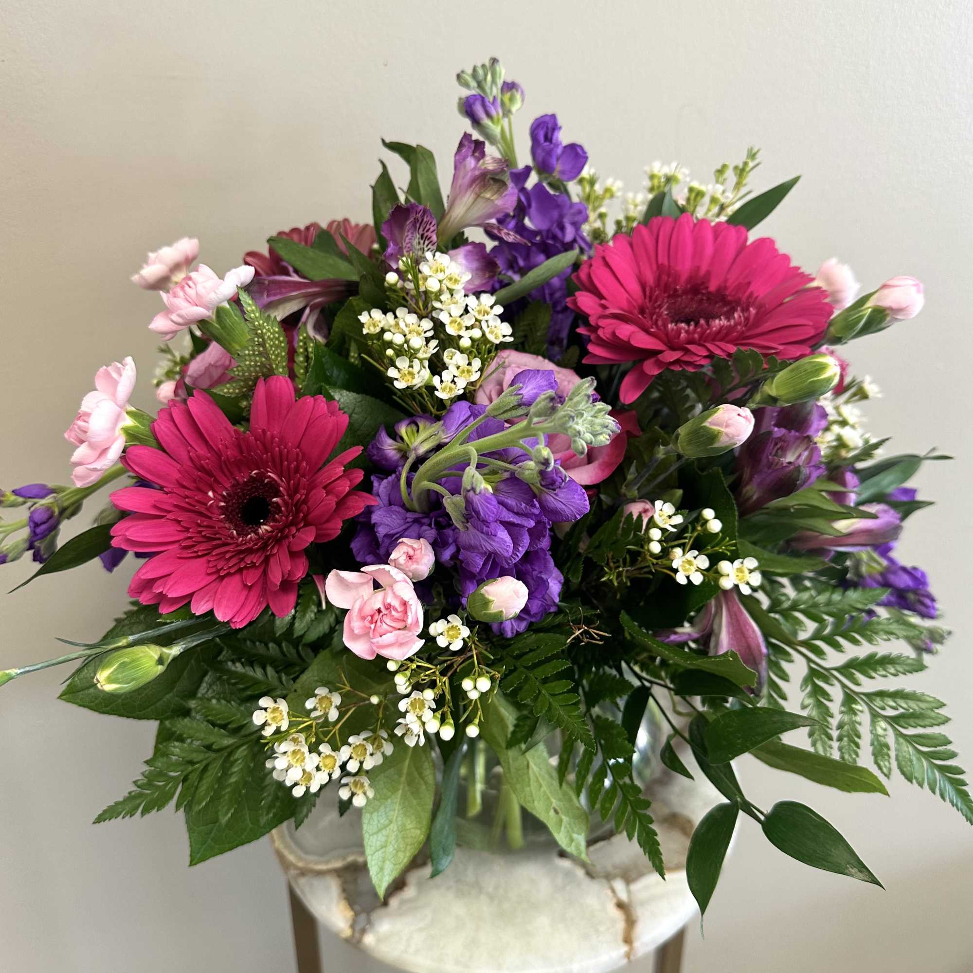 A delightful pink and lavender mix of roses, alstroemeria, hot pink gerbera