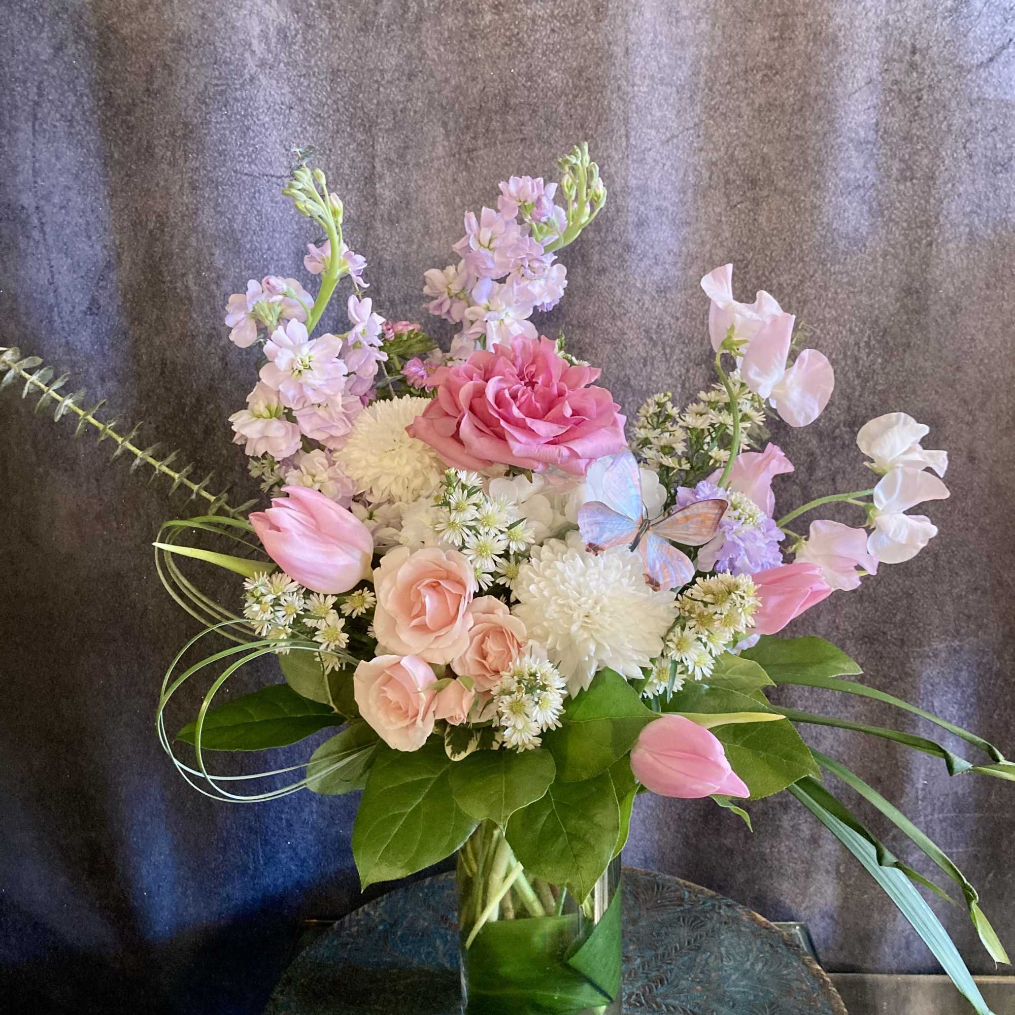 Pink and white mixed bouquet in a clear glass vase