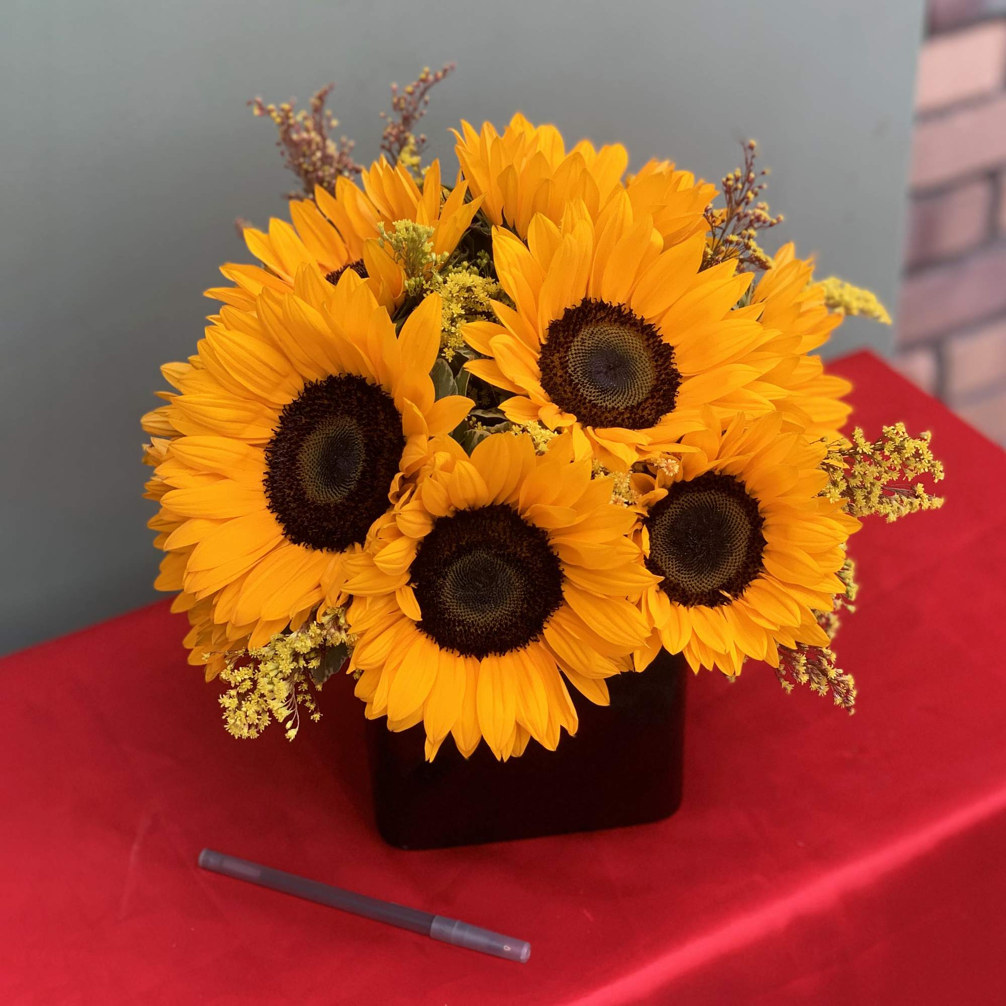 A pretty design of Sunflowers and Greens. 